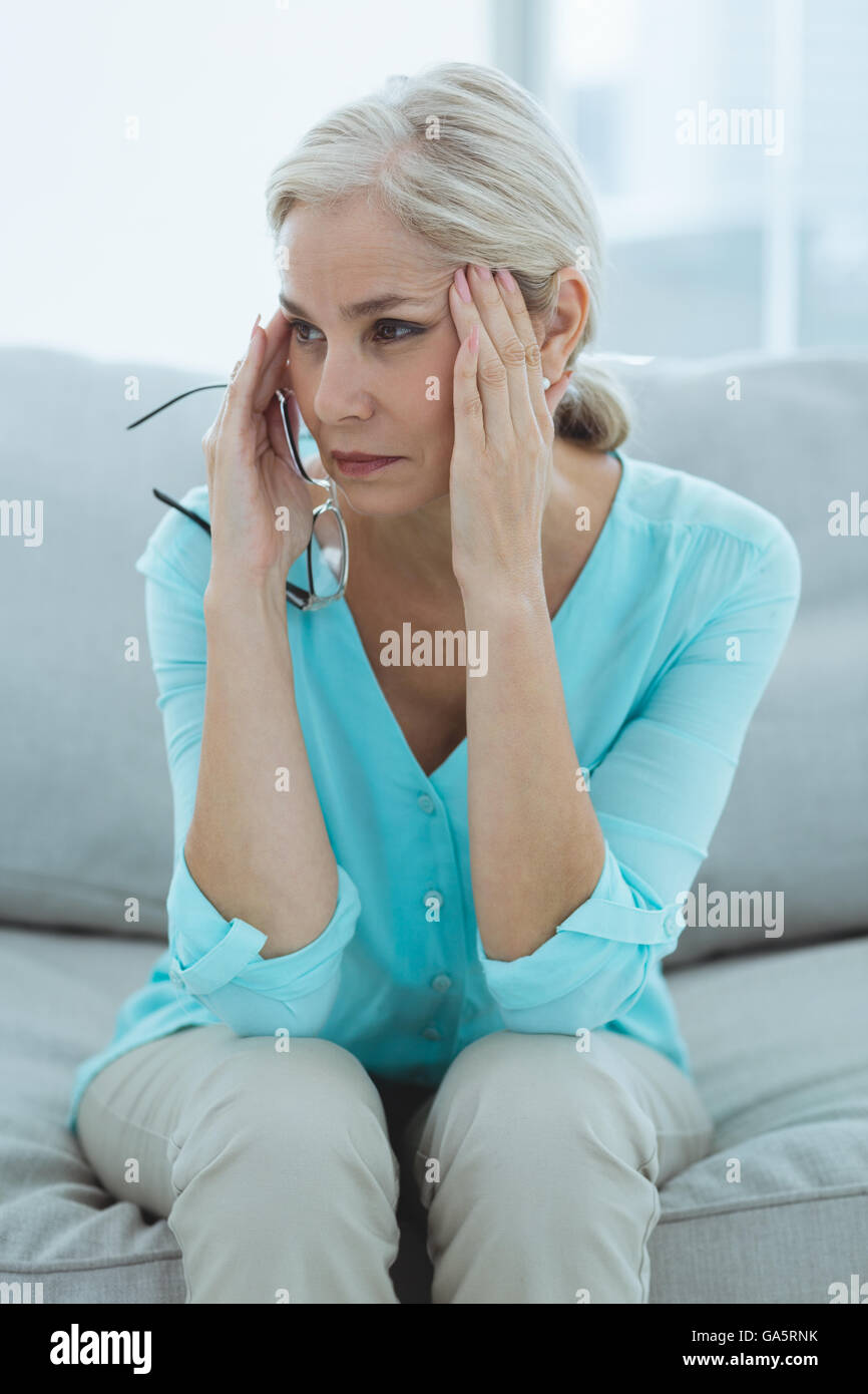 Senior woman suffering headache Stock Photo