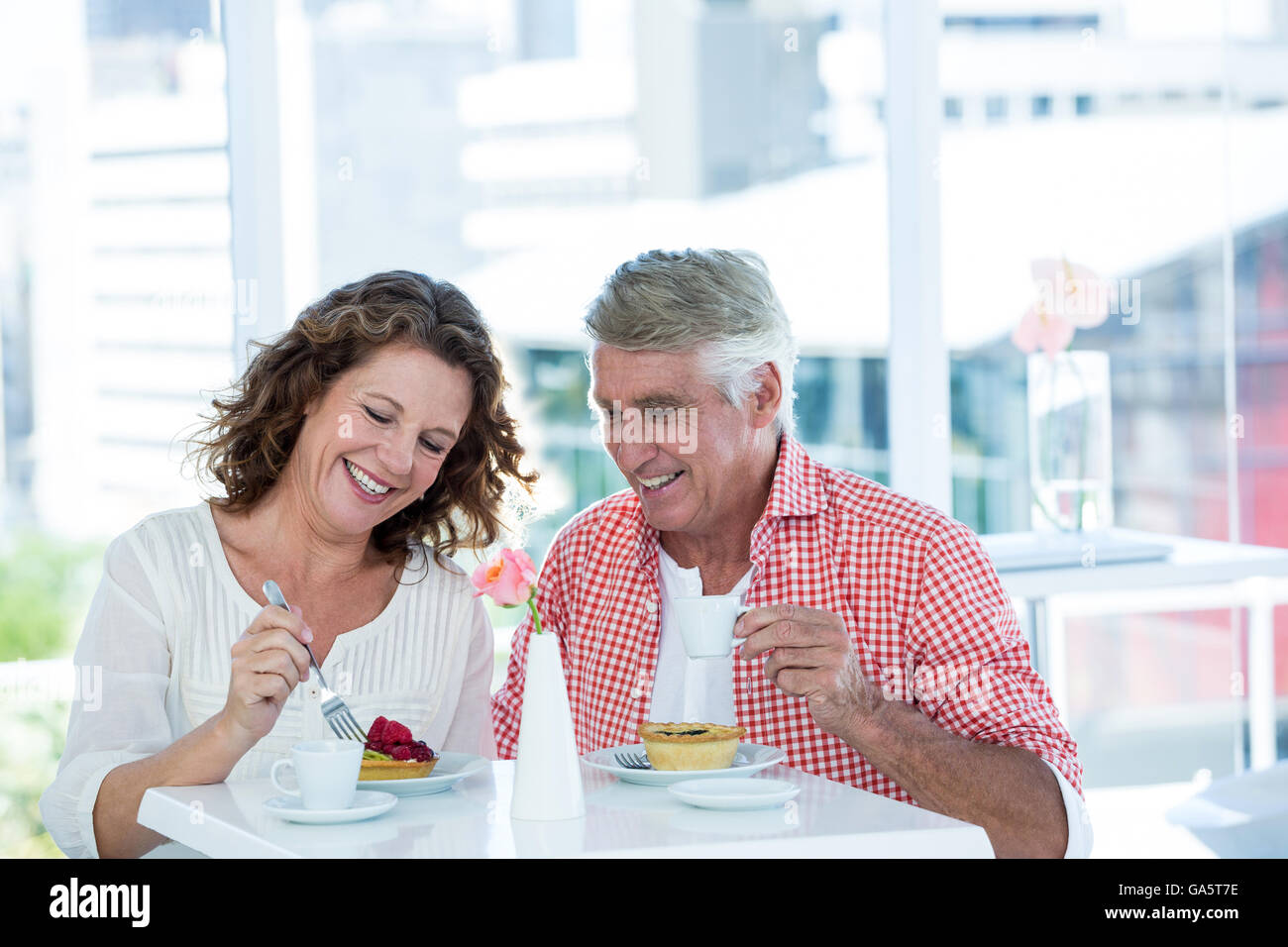 Couple enjoying food at restaurant Stock Photo