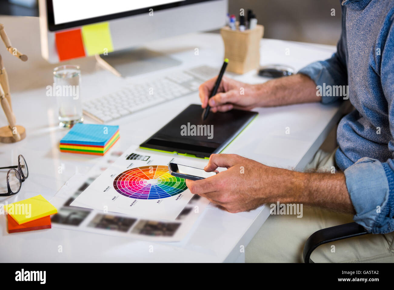 Midsection of businessman using graphics tablet Stock Photo