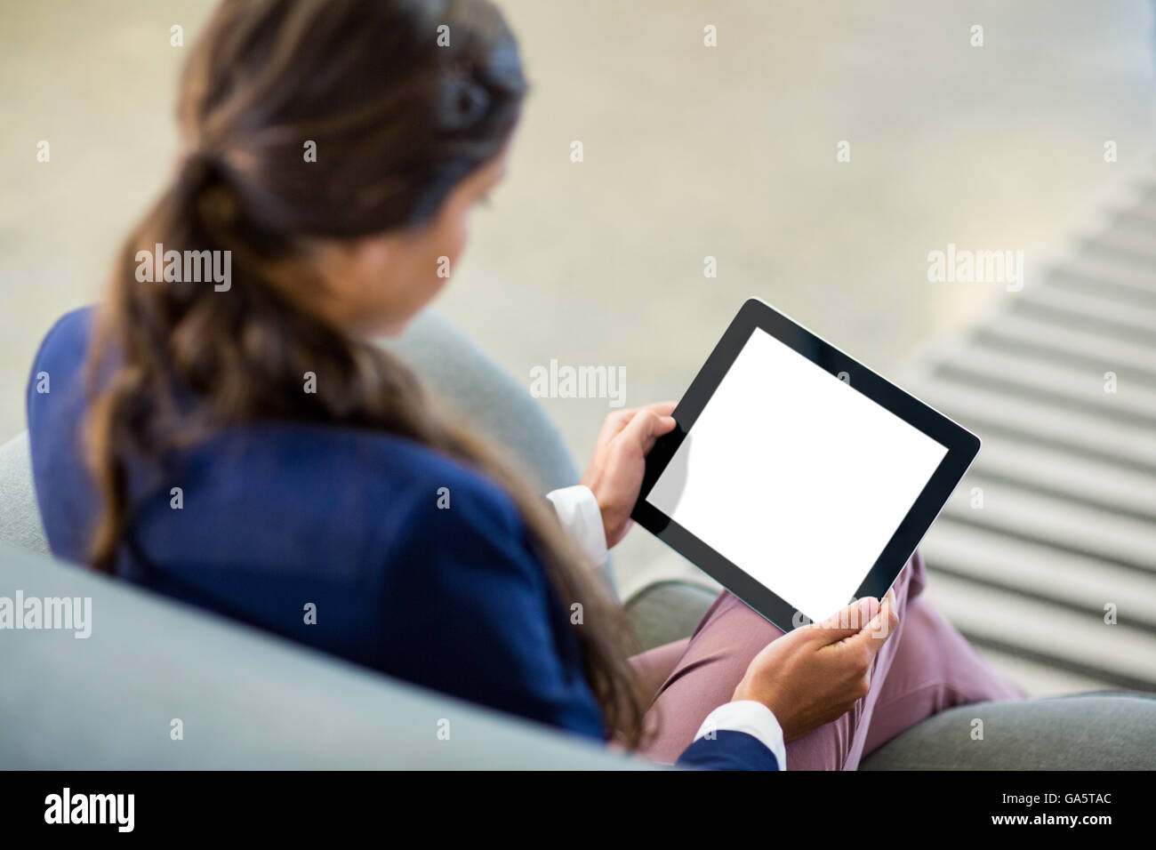 Woman using digital tablet Stock Photo - Alamy