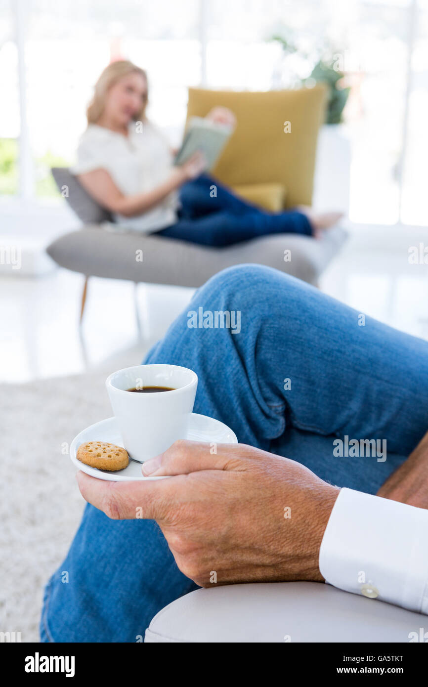 Midsection of man having breakfast at home Stock Photo