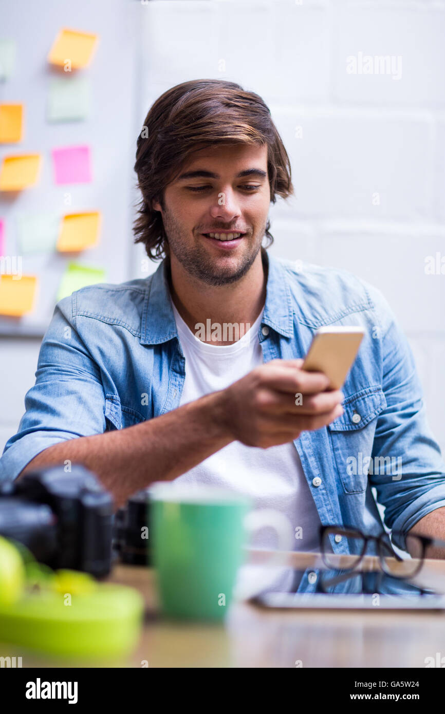Man using mobile phone in office Stock Photo Alamy