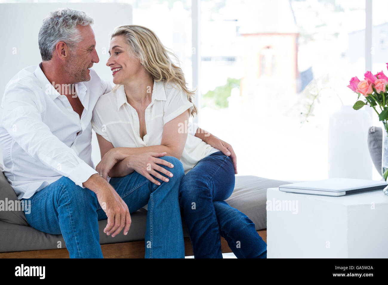 Romantic mature couple sitting face to face Stock Photo