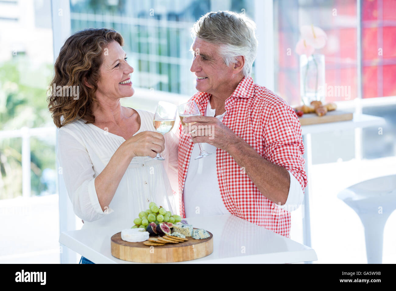 Smiling couple toasting champagne at restaurant Stock Photo