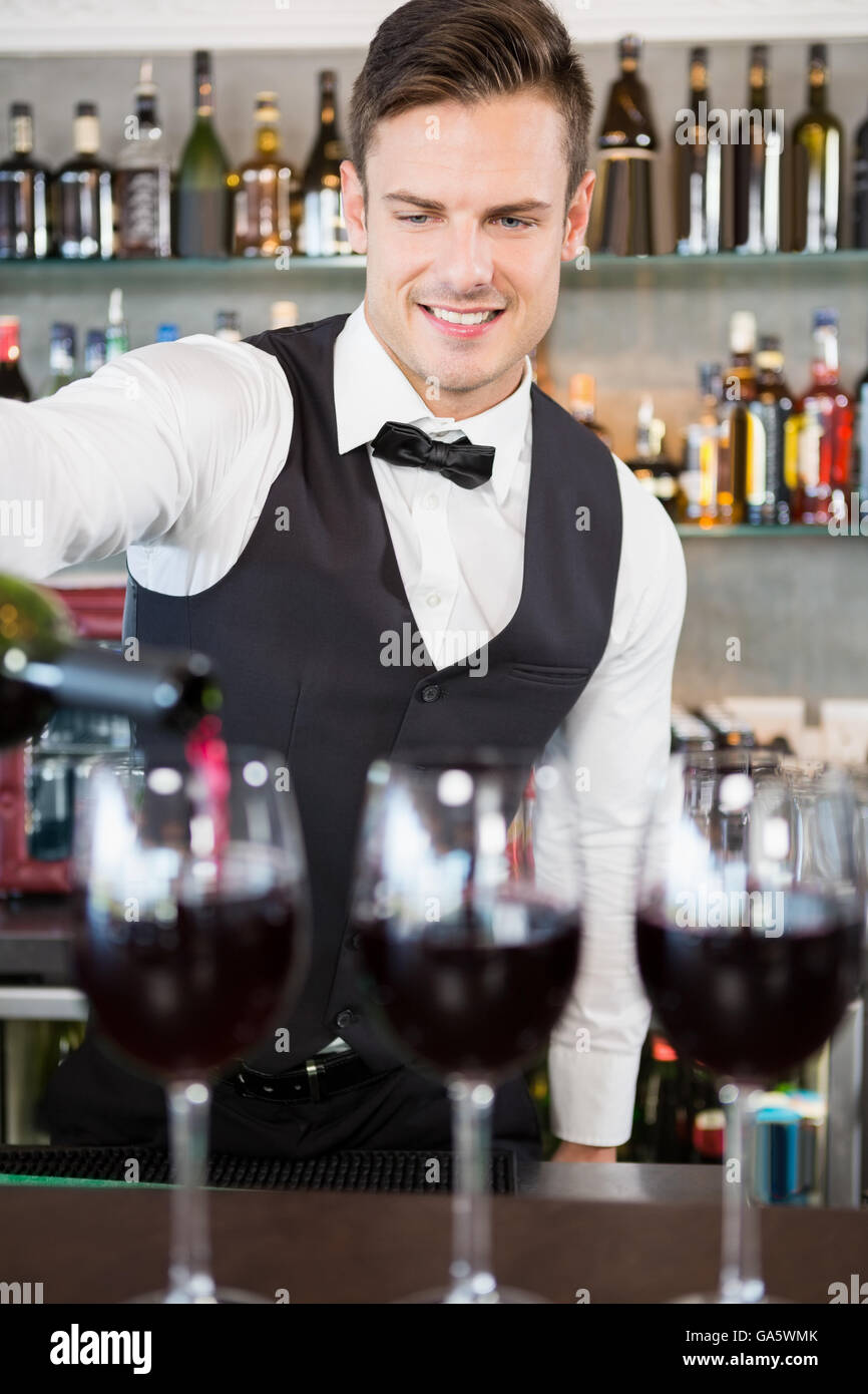 Waiter pouring wine hires stock photography and images Alamy