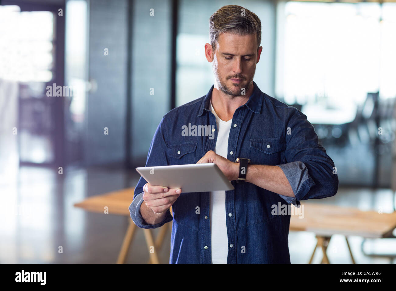 Man Checking Checking time hi-res stock photography and images - Alamy
