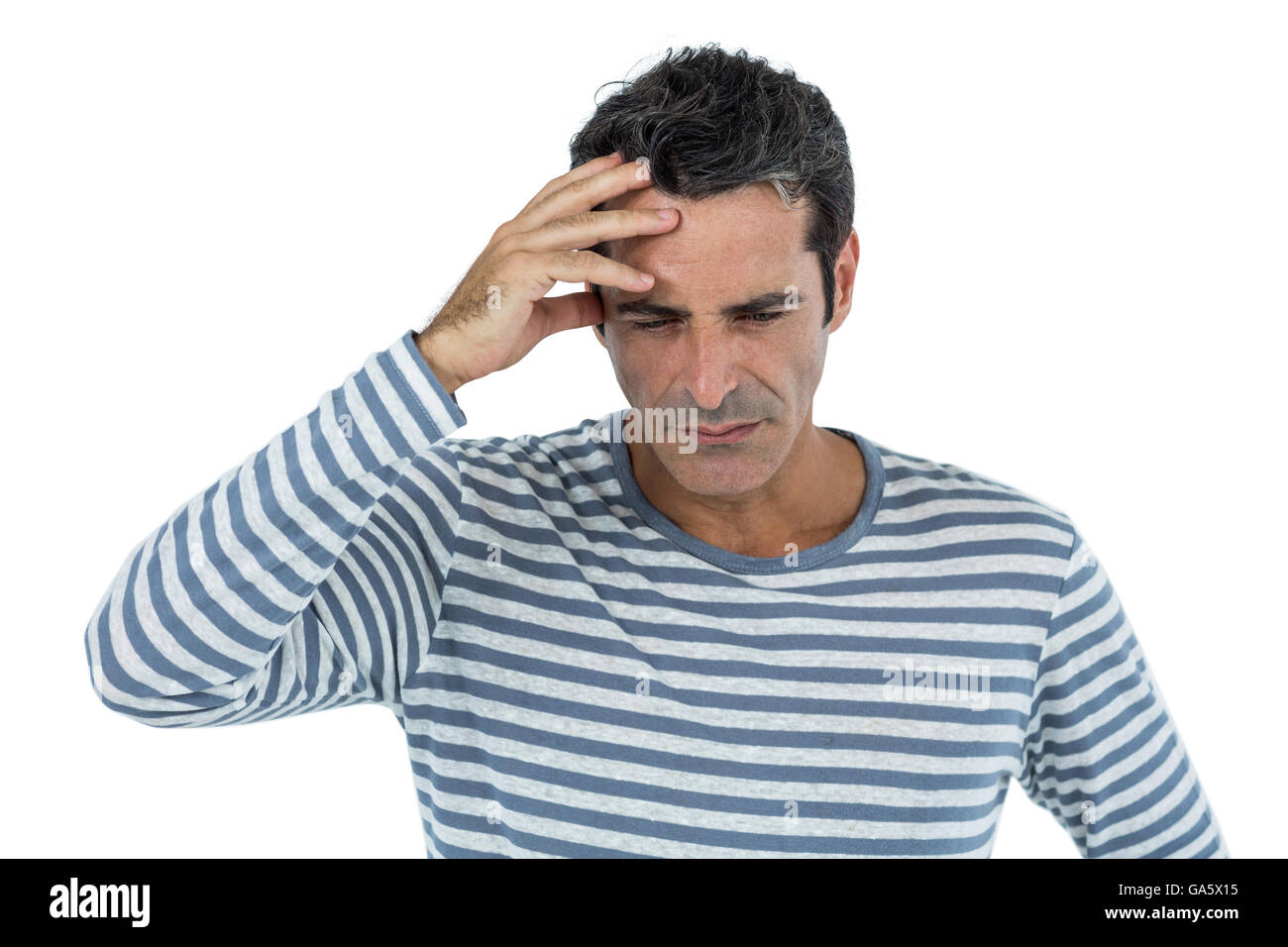 Stressed mid adult man against white background Stock Photo