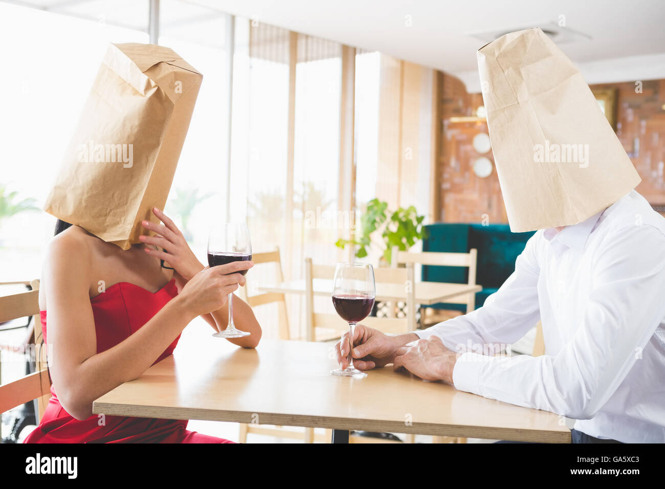 couple-with-brown-paper-bags-over-their-heads-stock-photo-alamy