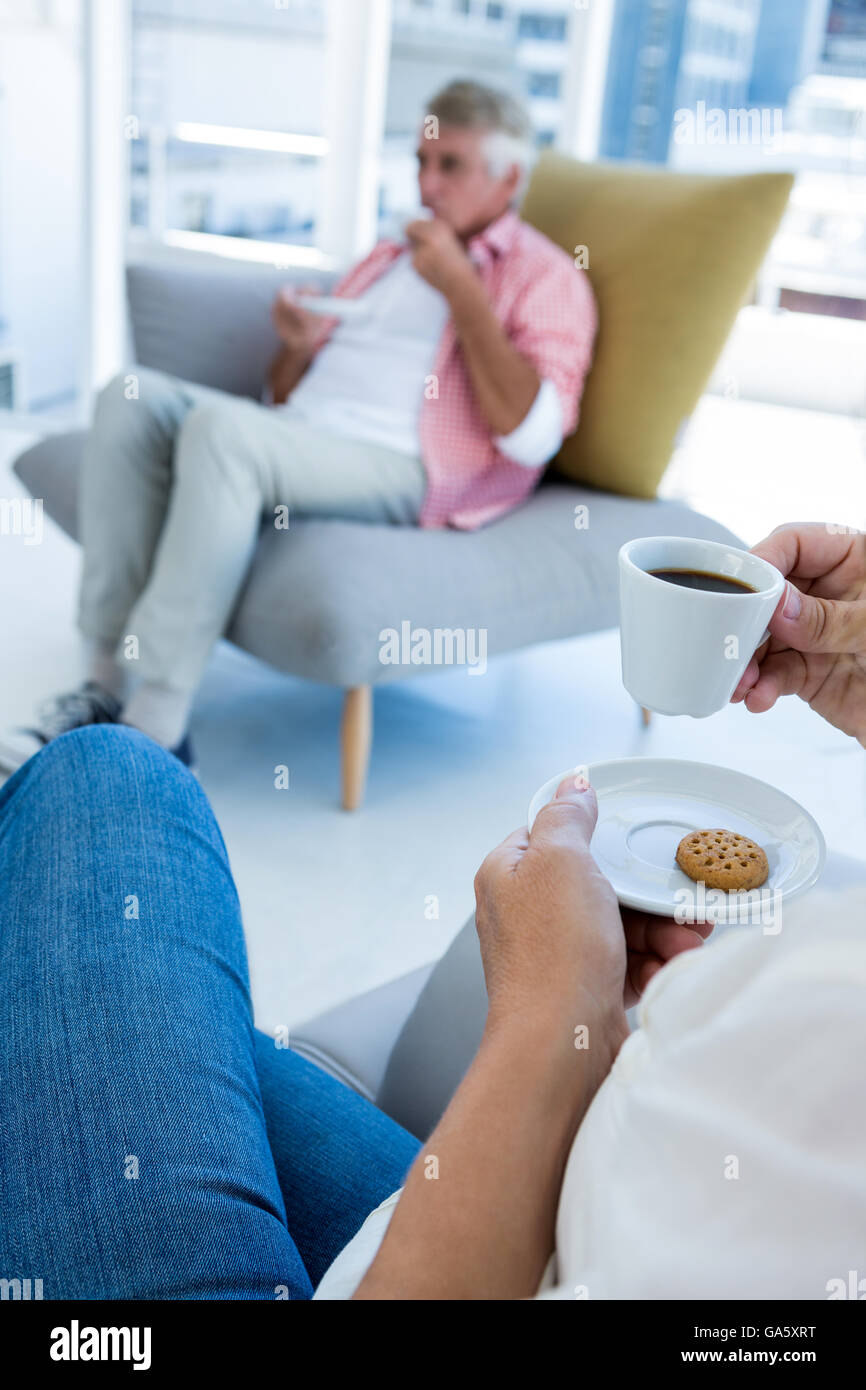 Midsection of woman having breakfast  at home Stock Photo