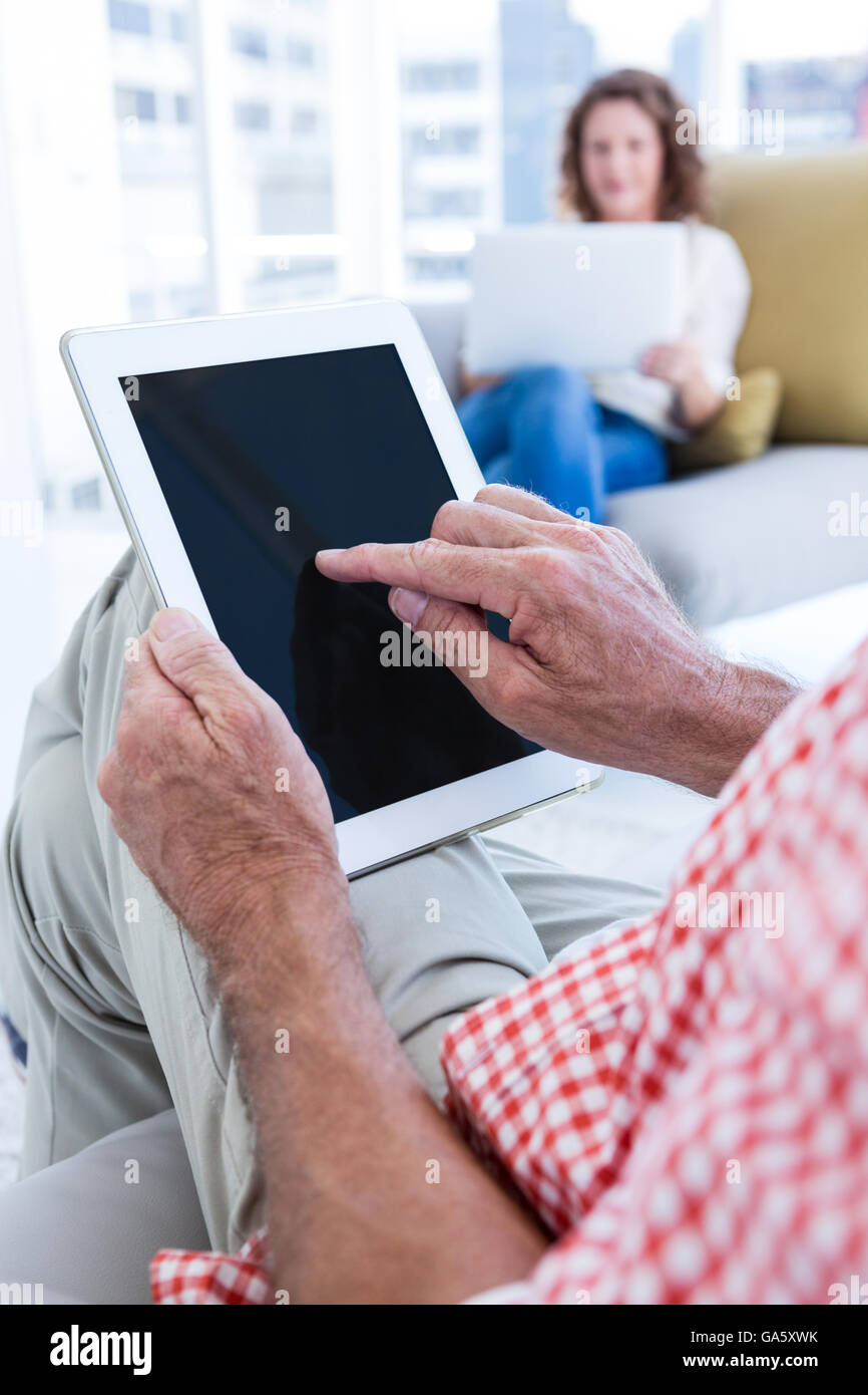 Elderly man touching tablet hi-res stock photography and images - Alamy