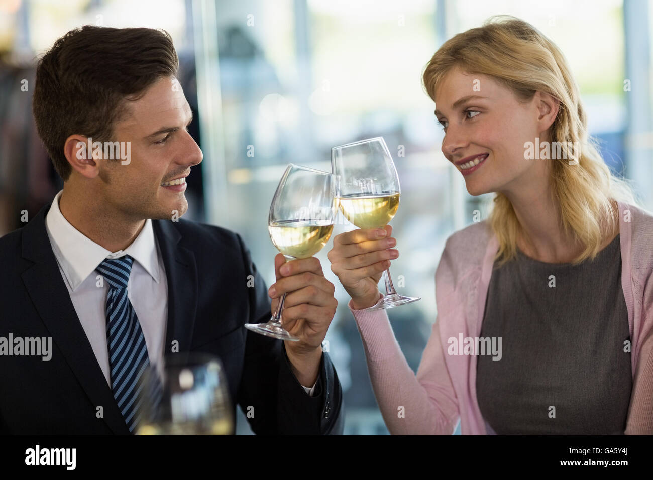 Smiling business colleagues toasting beer glass Stock Photo