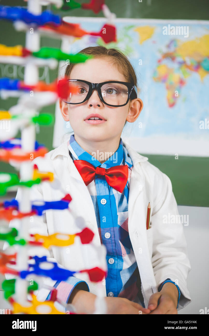 School girl assembling molecule model for science project in lab Stock Photo