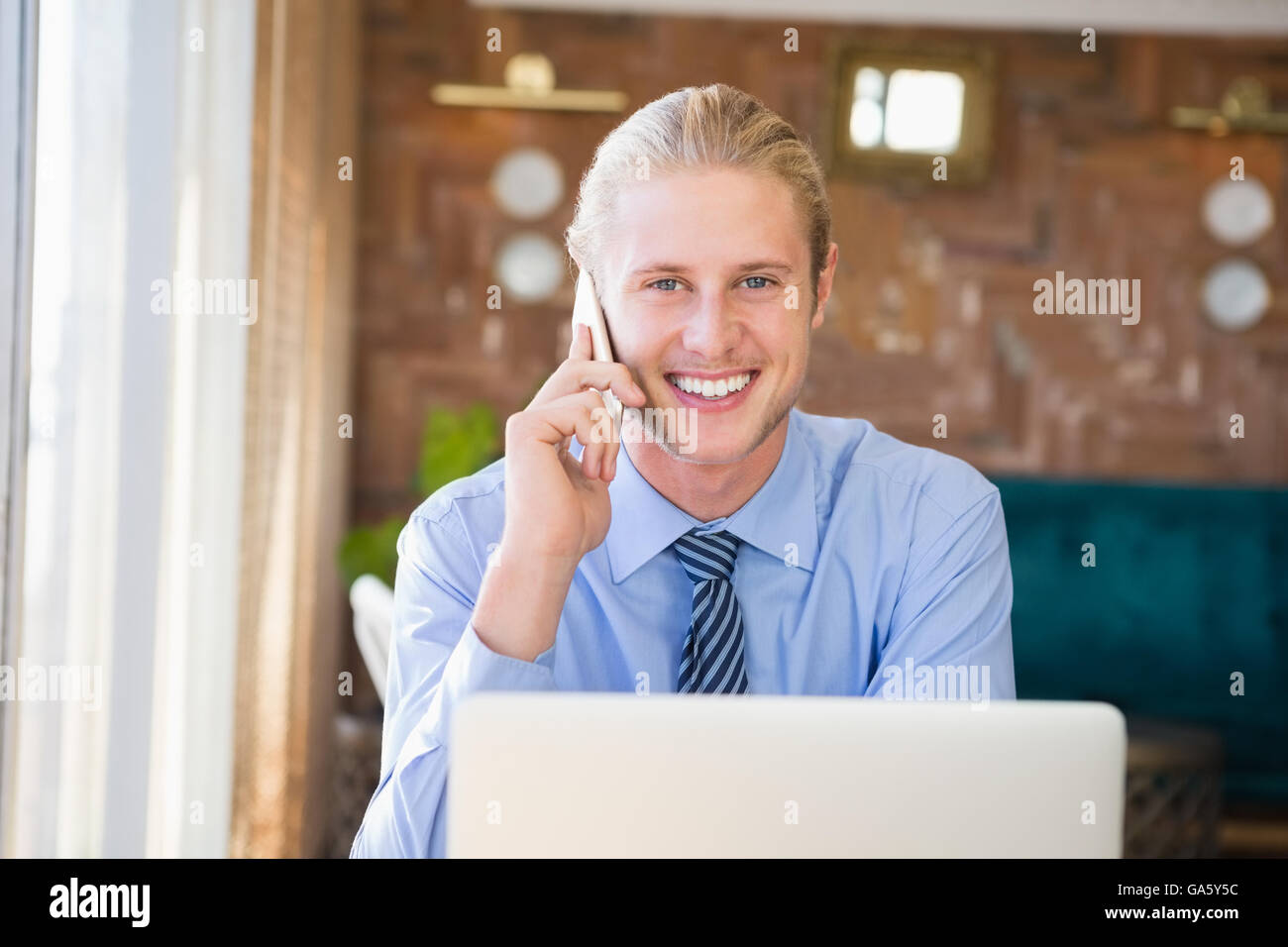 Happy man talking on mobile phone Stock Photo