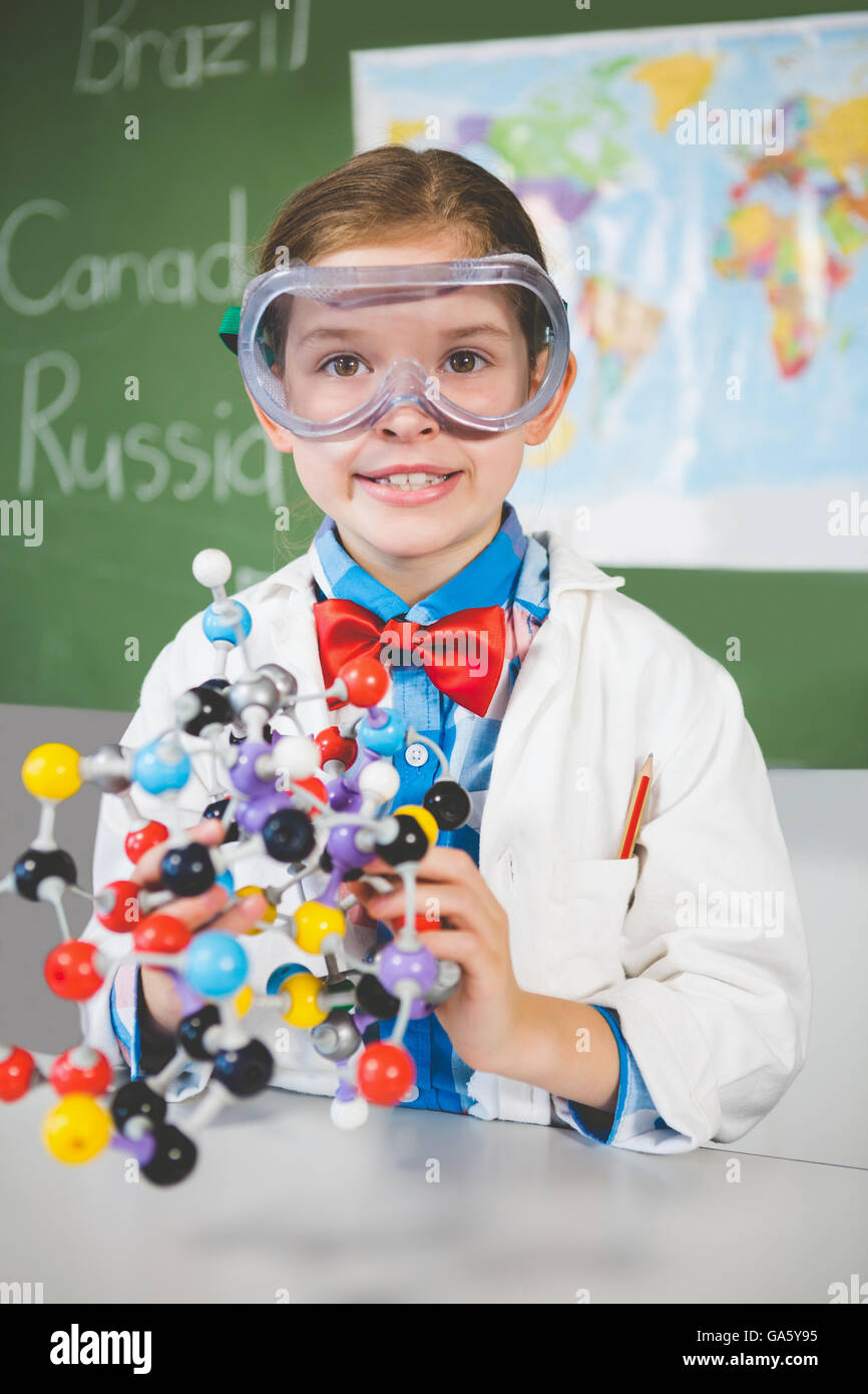 School girl assembling molecule model for science project in lab Stock Photo