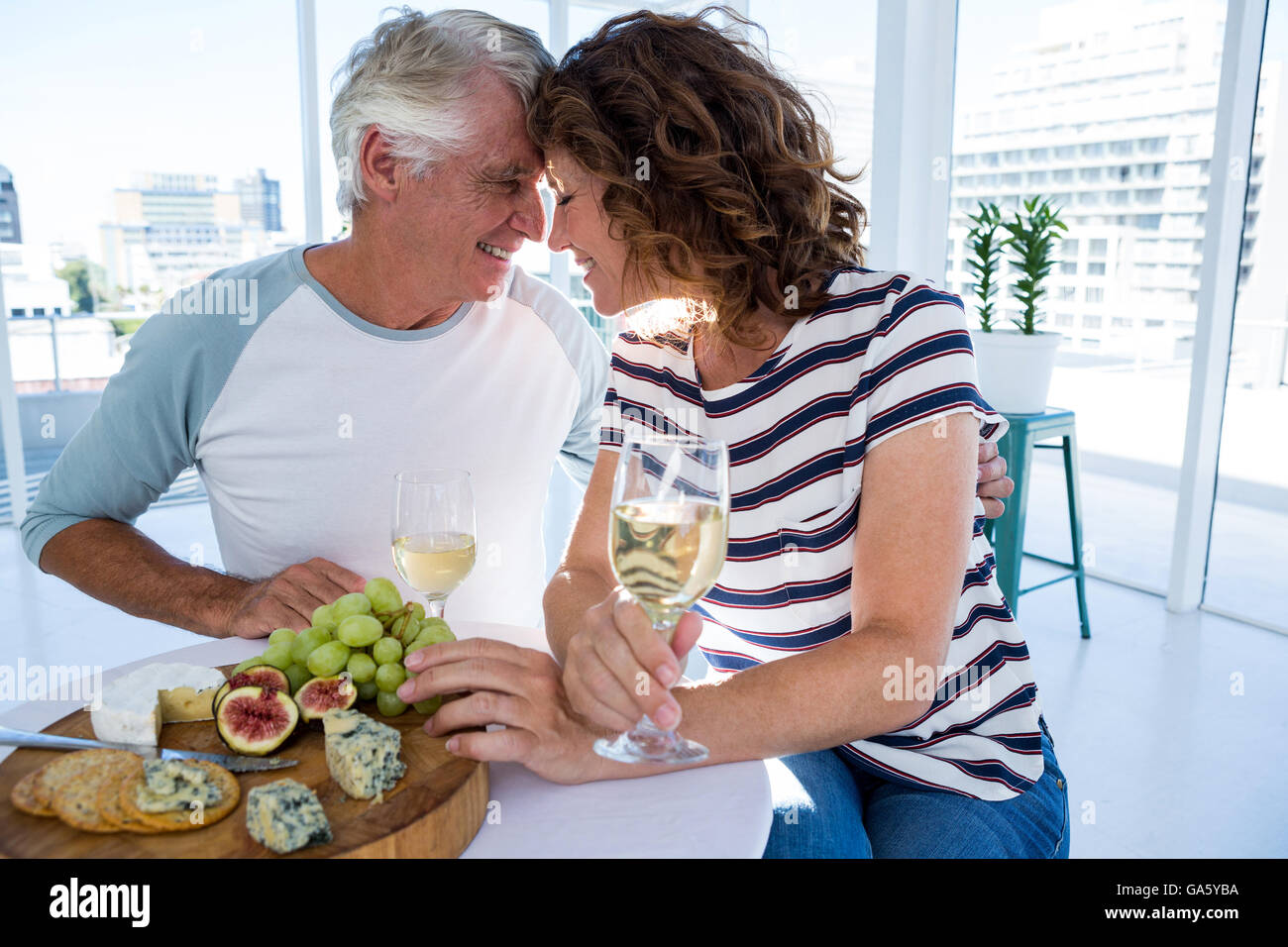 Romantic couple sitting at restaurant Stock Photo