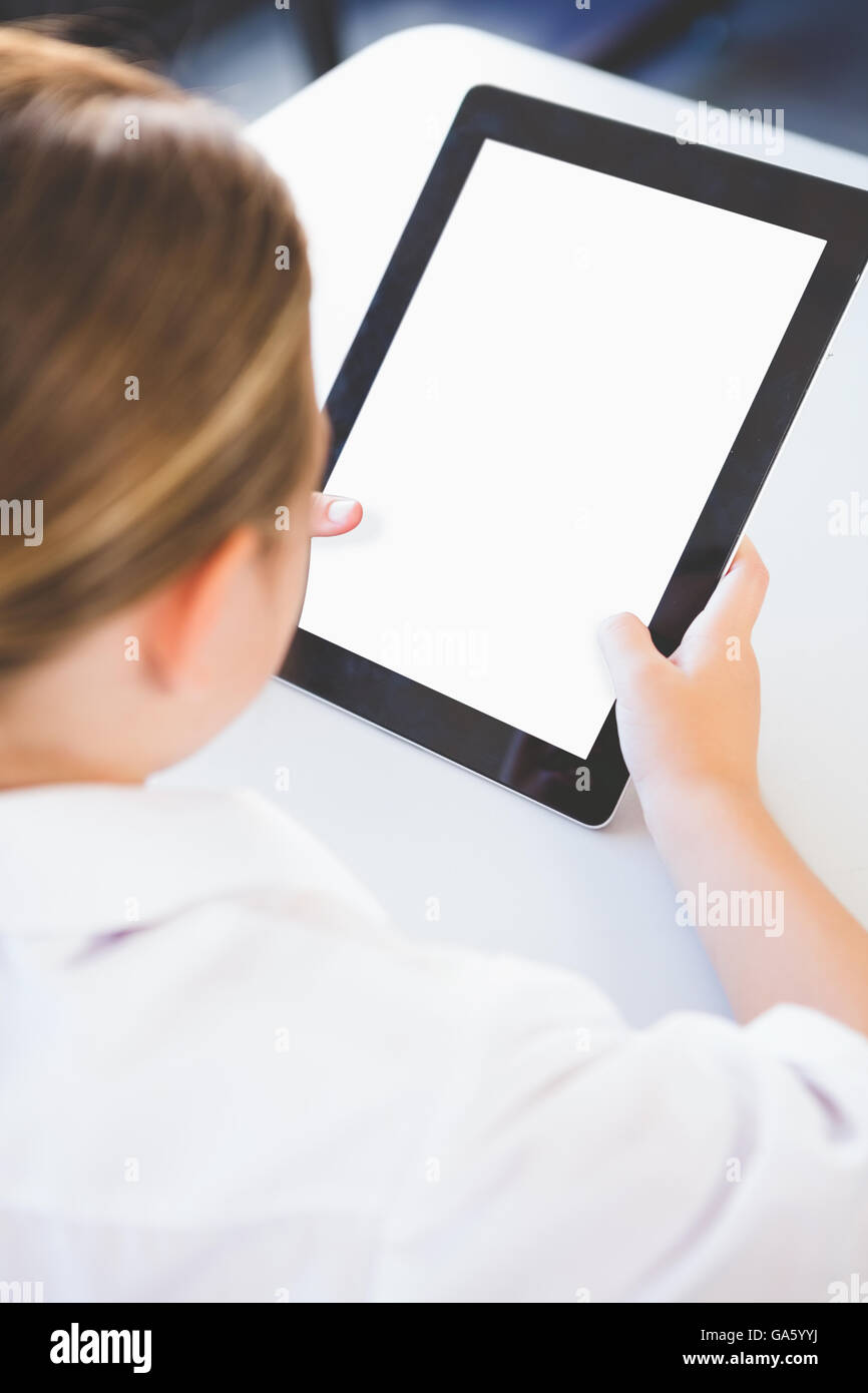 Schoolkid using digital tablet in classroom Stock Photo Alamy