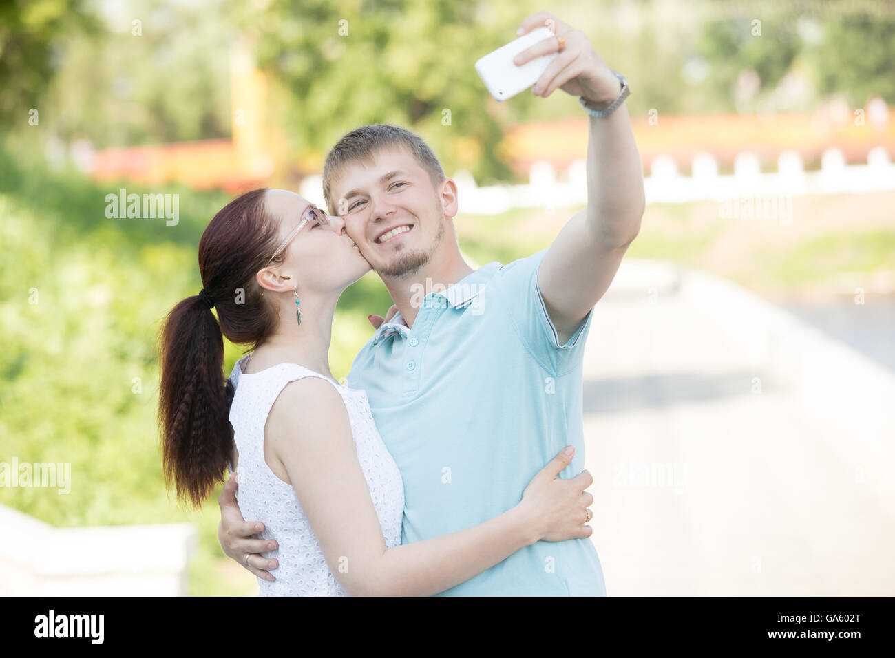 Beautiful woman kissing man hi-res stock photography and images - Alamy