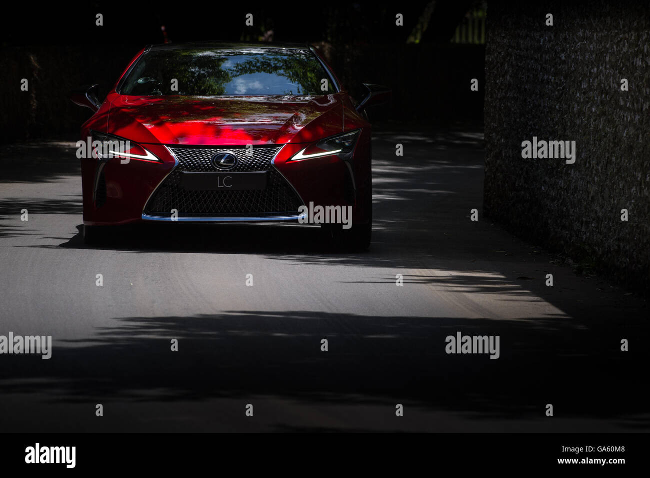 A Lexus LC 500 drives past the flint wall during the Super Car Run at the Goodwood Festival of Speed 2016 Stock Photo