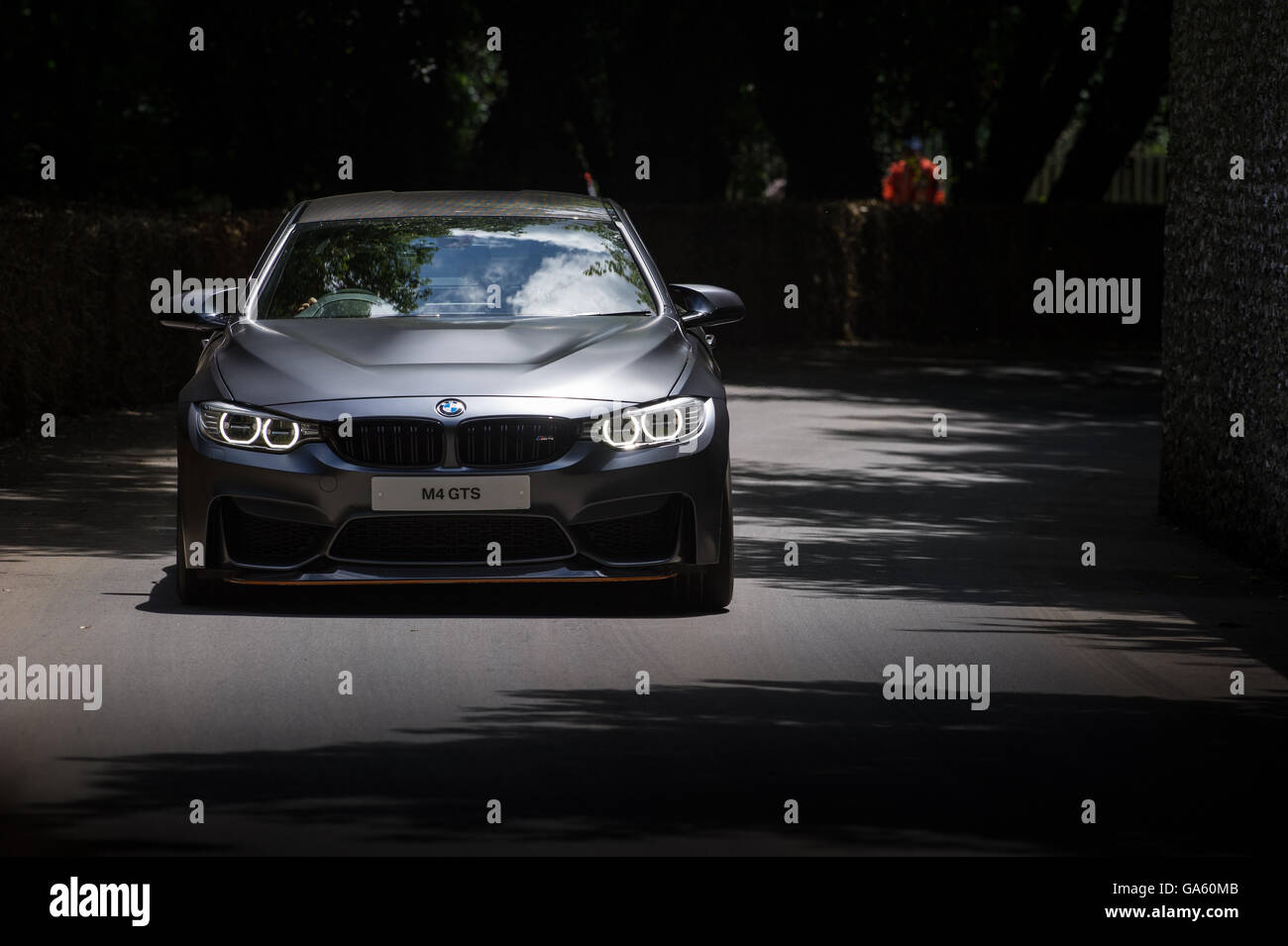 A BMW M4 GTS drives past the flint wall during the Super Car Run at the Goodwood Festival of Speed 2016 Stock Photo