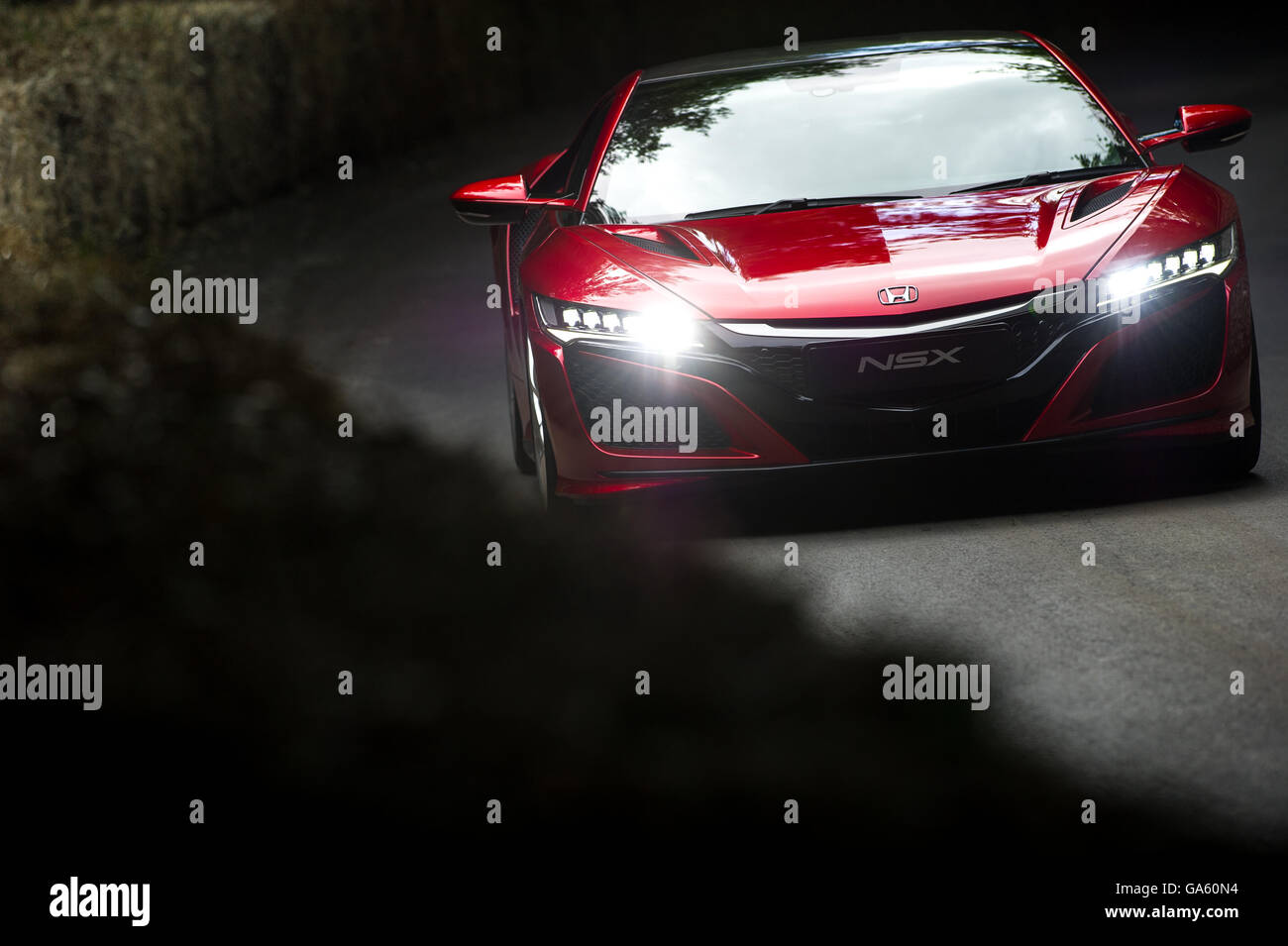 A Honda NSX drives past the flint wall at the Goodwood Festival of Speed 2016 Stock Photo