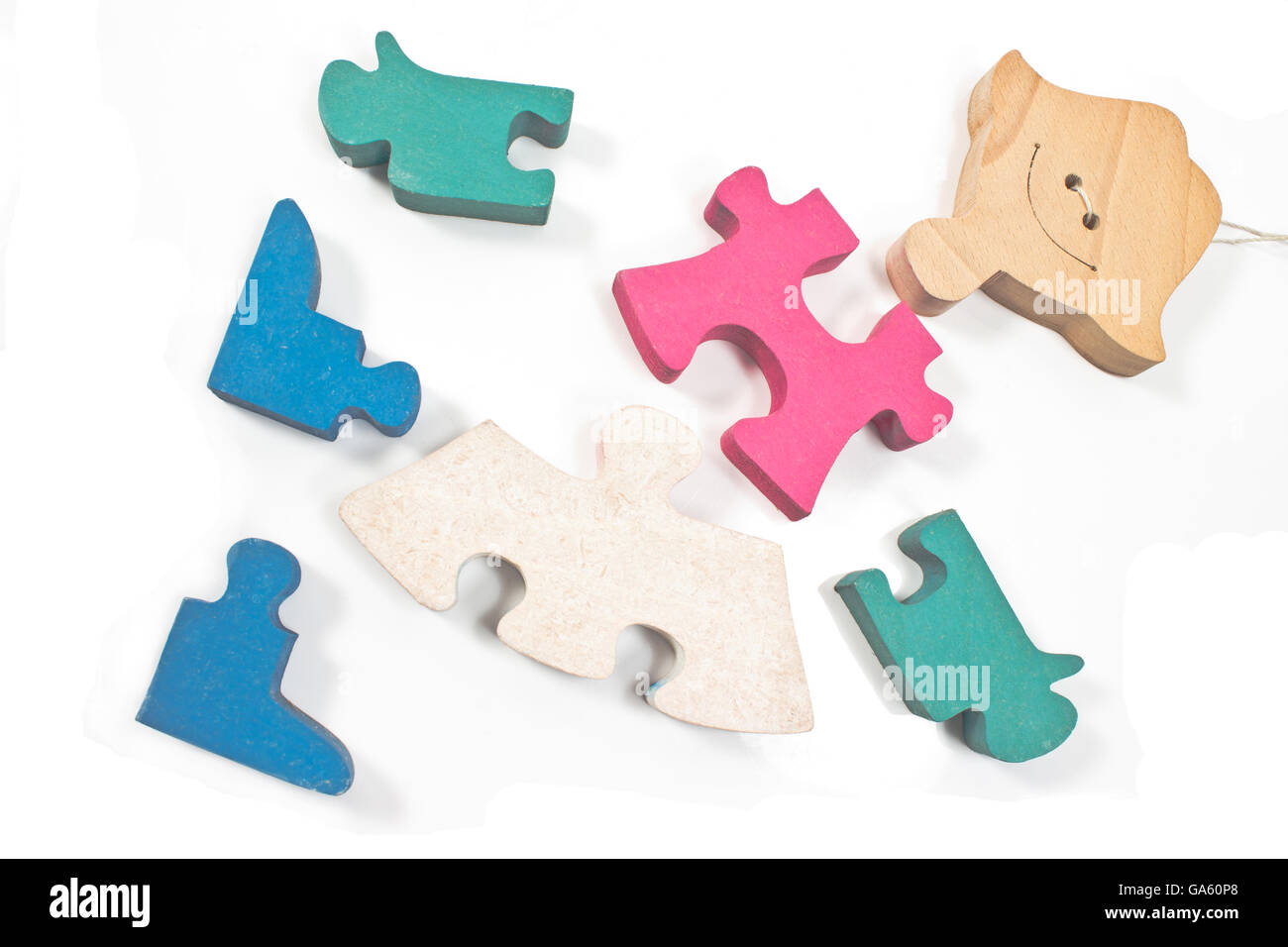 Colorful wooden girl puzzle pieces isolated on white Stock Photo