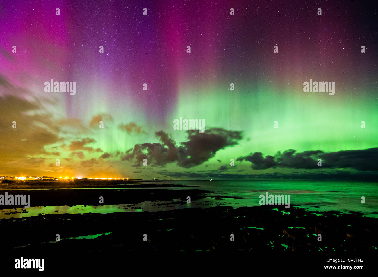 A strong solar storm creates a bright display of the northern lights