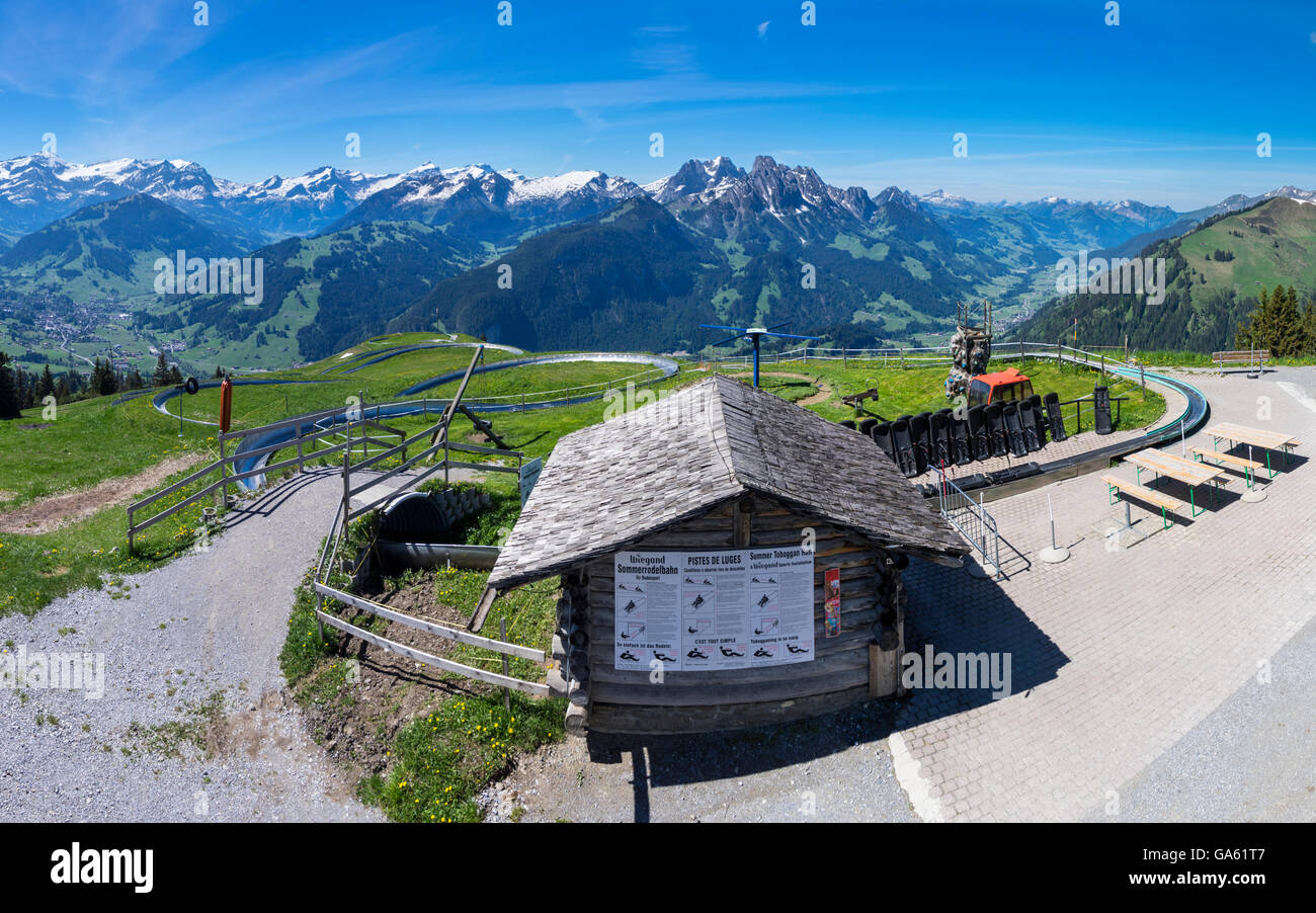 Wide-angle panorama of a mountain coaster run on Rellerli mountain, close to Gstaad, Switzerland. Stock Photo