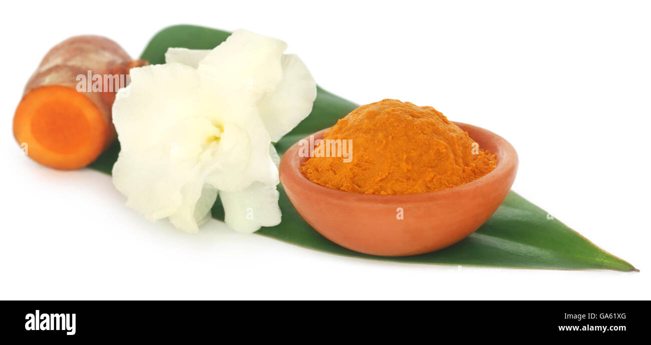 Turmeric with white flower on green leaf Stock Photo
