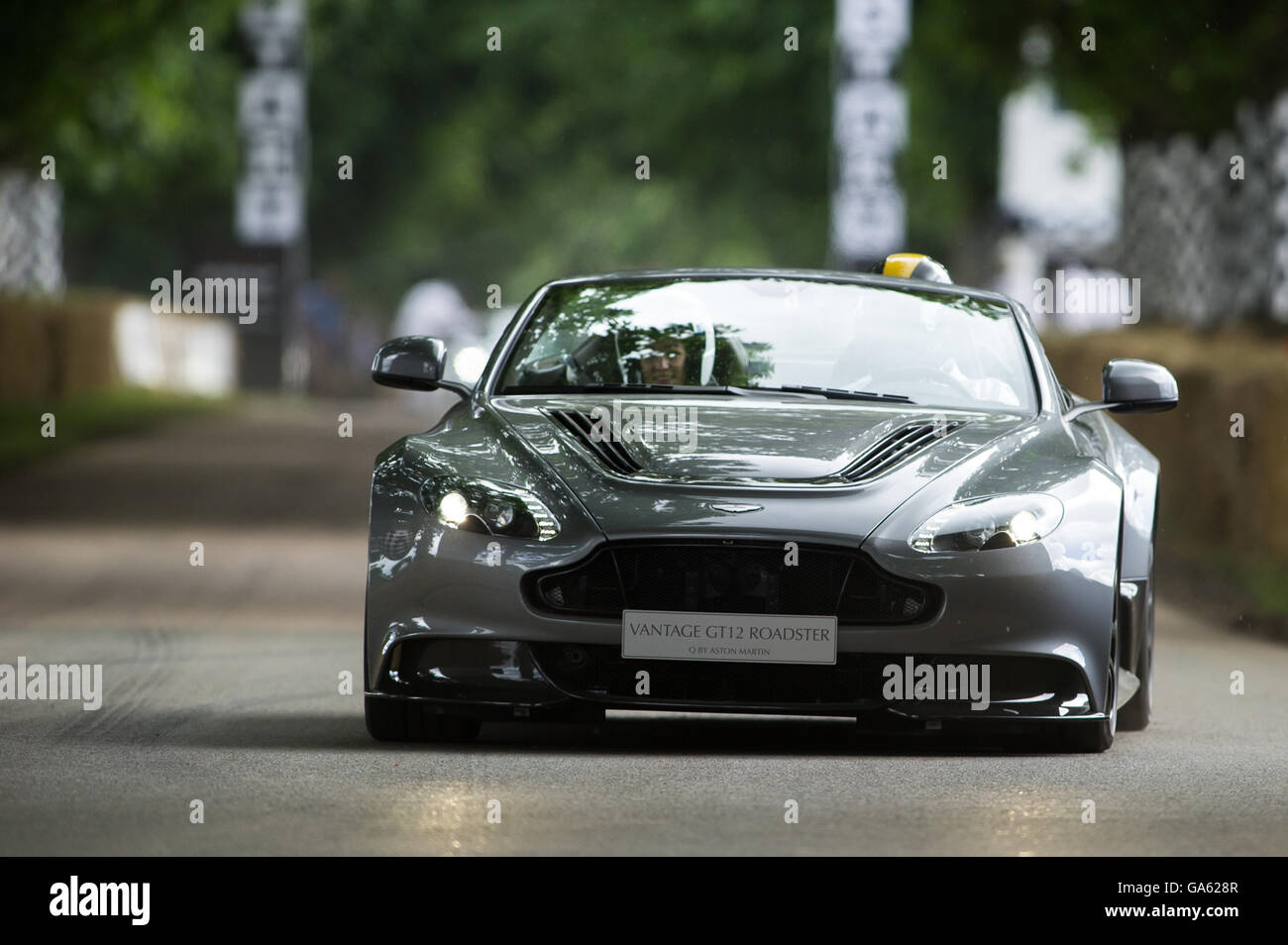 An Aston Martin Vantage GT12 Roadster drives up the hill at the Goodwood Festival of Speed 2016 Stock Photo