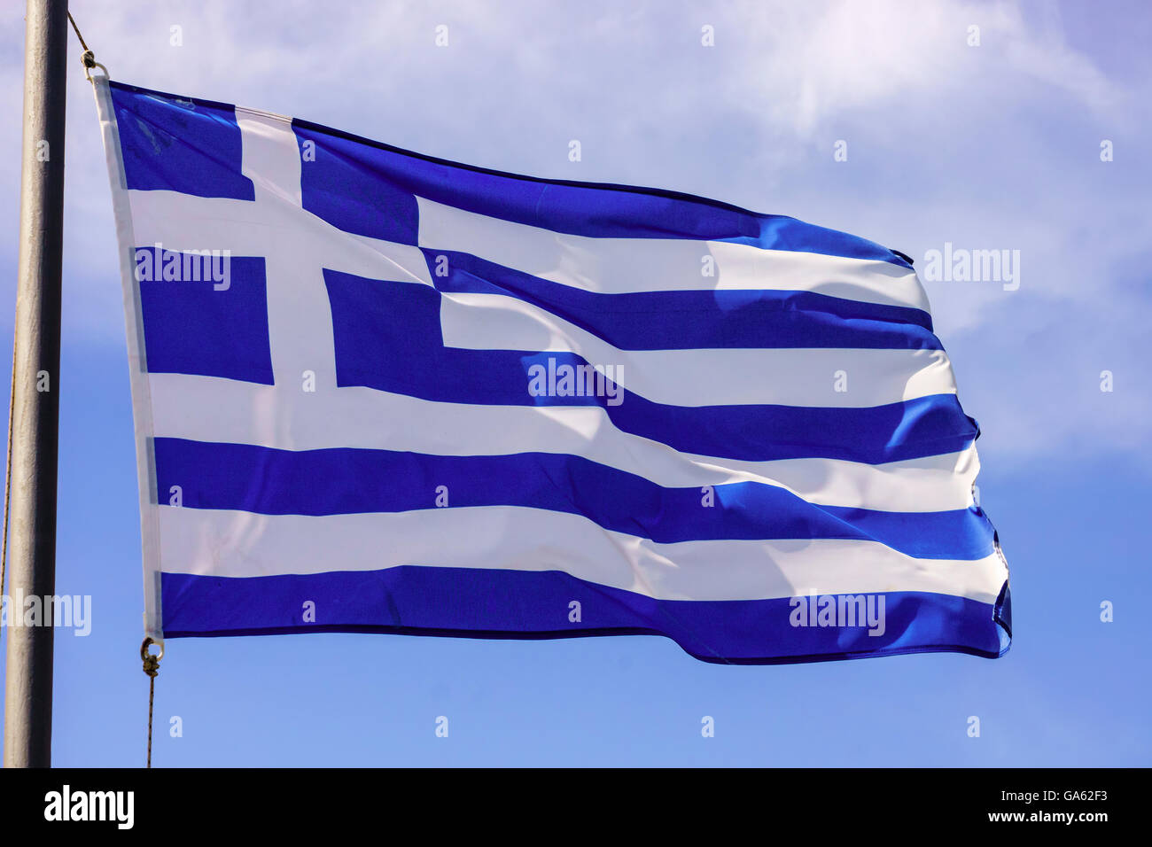 Blue and white Greek flag on a pole. Stock Photo