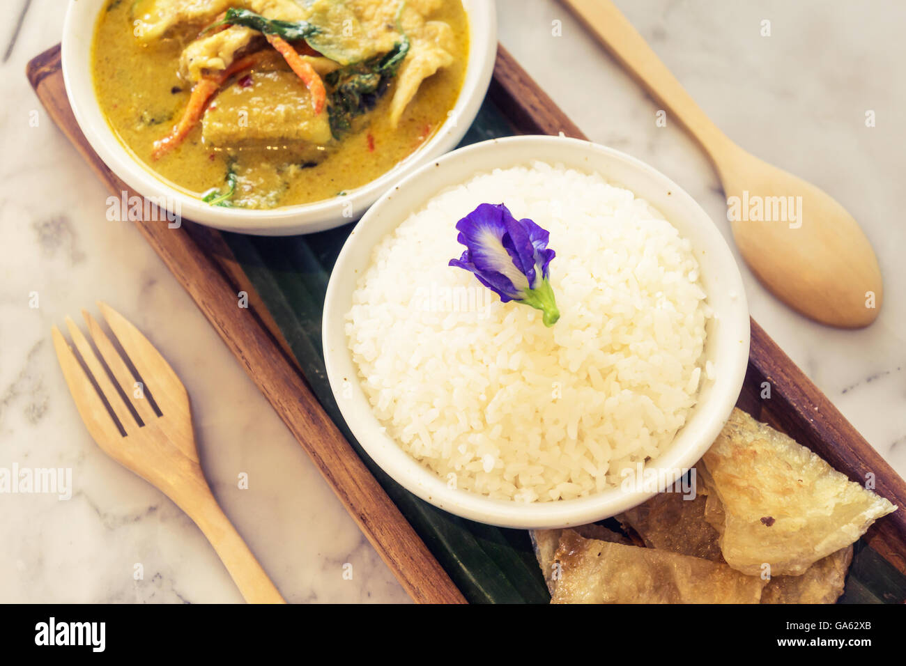Thai chicken green curry with rice Stock Photo