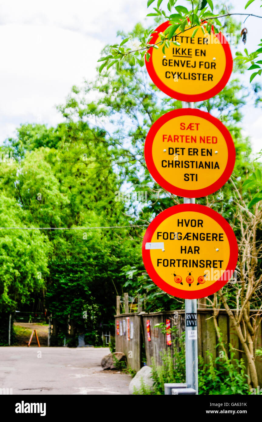 'This is not a shortcut for cyclists. Slow down. Pedestrians have priority on paths in Christiana.' Stock Photo
