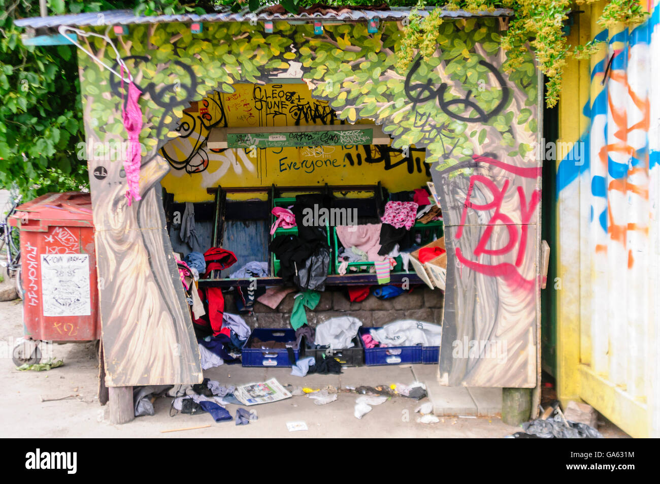 Clothes recycling centre in Freetown Christiana, Copenhagen, where residents can leave unwanted clothes for others to use. Stock Photo