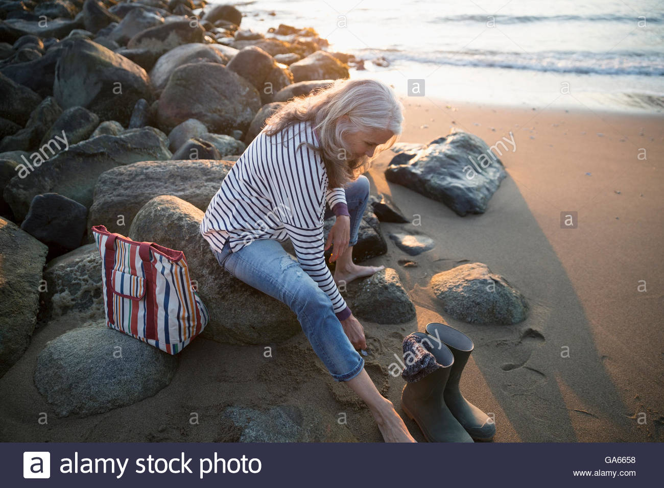 Taking off boots hi-res stock photography and images - Alamy