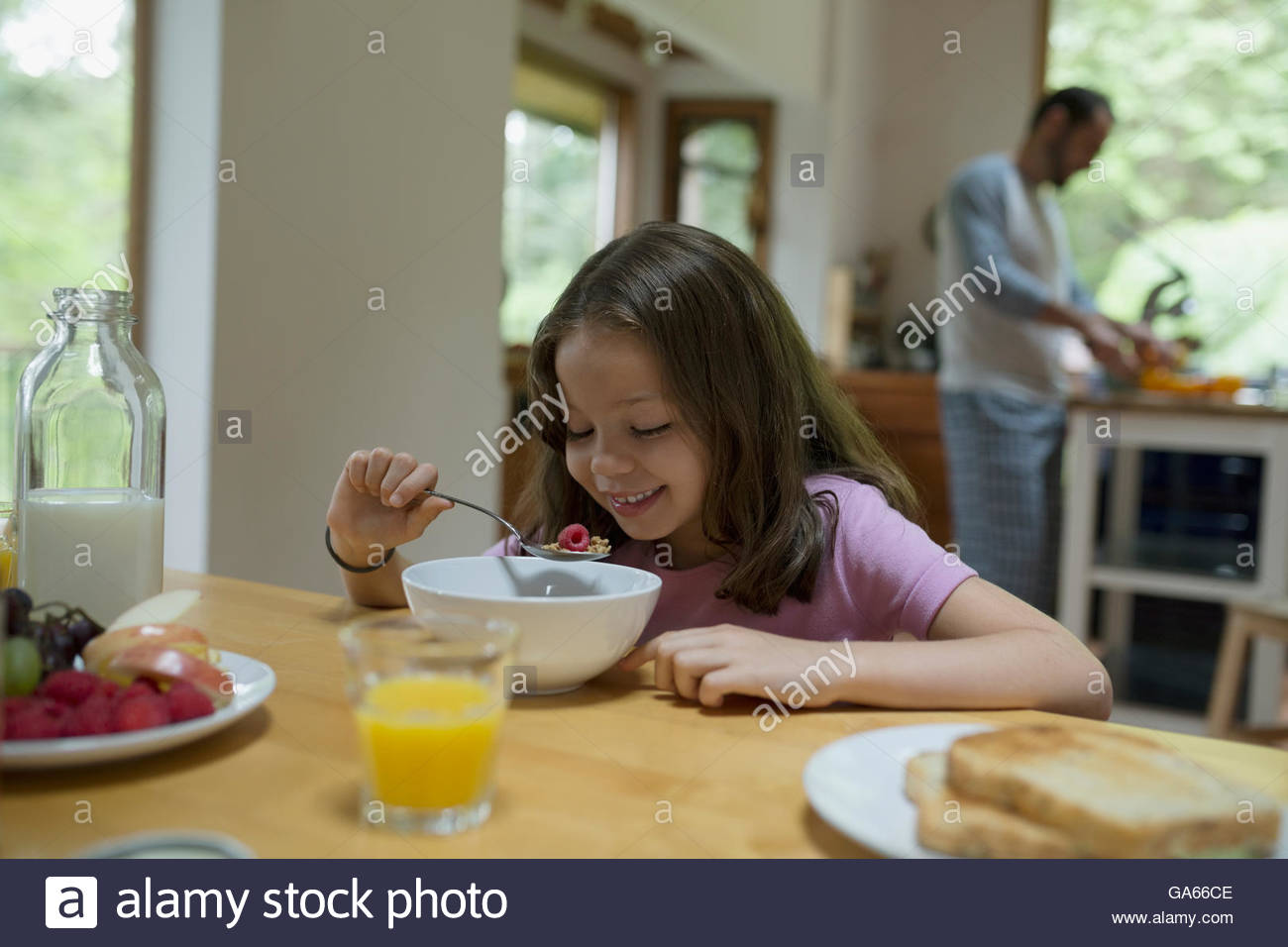 Girl eating breakfast hi-res stock photography and images - Alamy