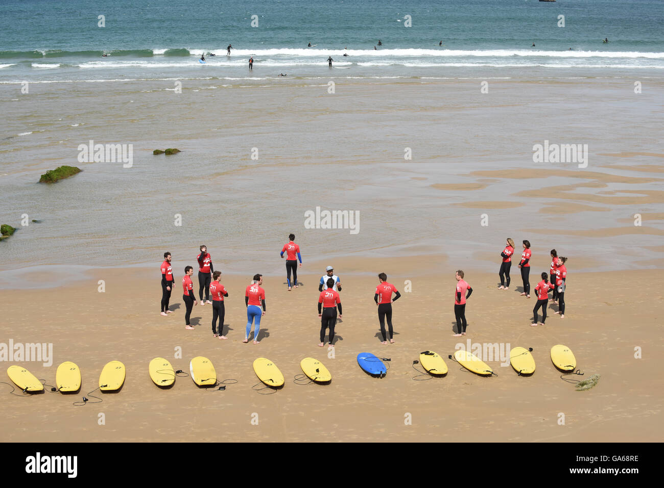 Surfers surfing school lesson with surf board Biarritz France Stock Photo