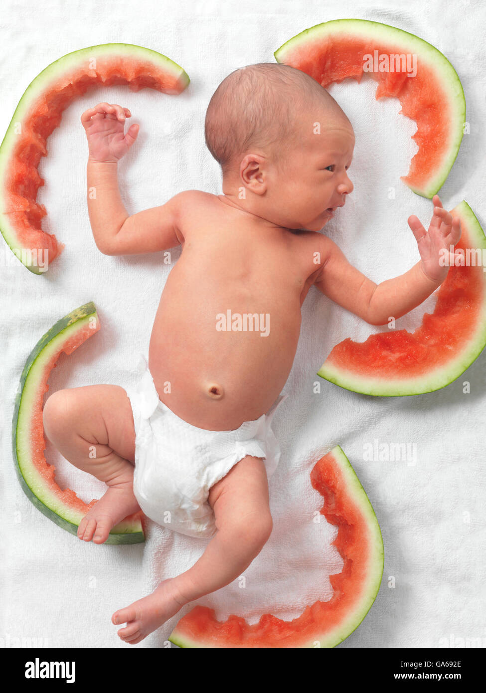 Newborn Baby In A Diaper Lying Down Amongst Watermelon Rinds Stock Photo Alamy