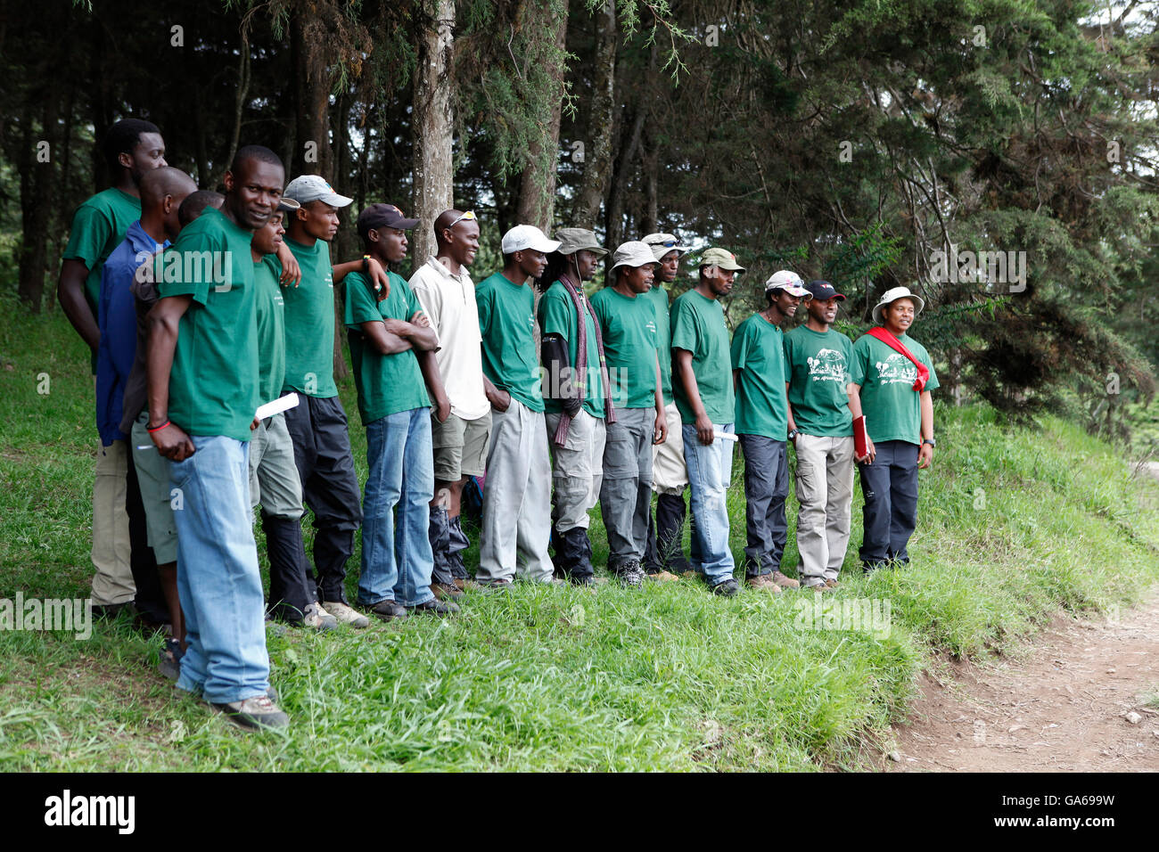 Local helpers and guides waiting at the forest edge for the Kilimanjaro Climb, Marangu Route to Mt. Kilimanjaro, Tanzania Stock Photo