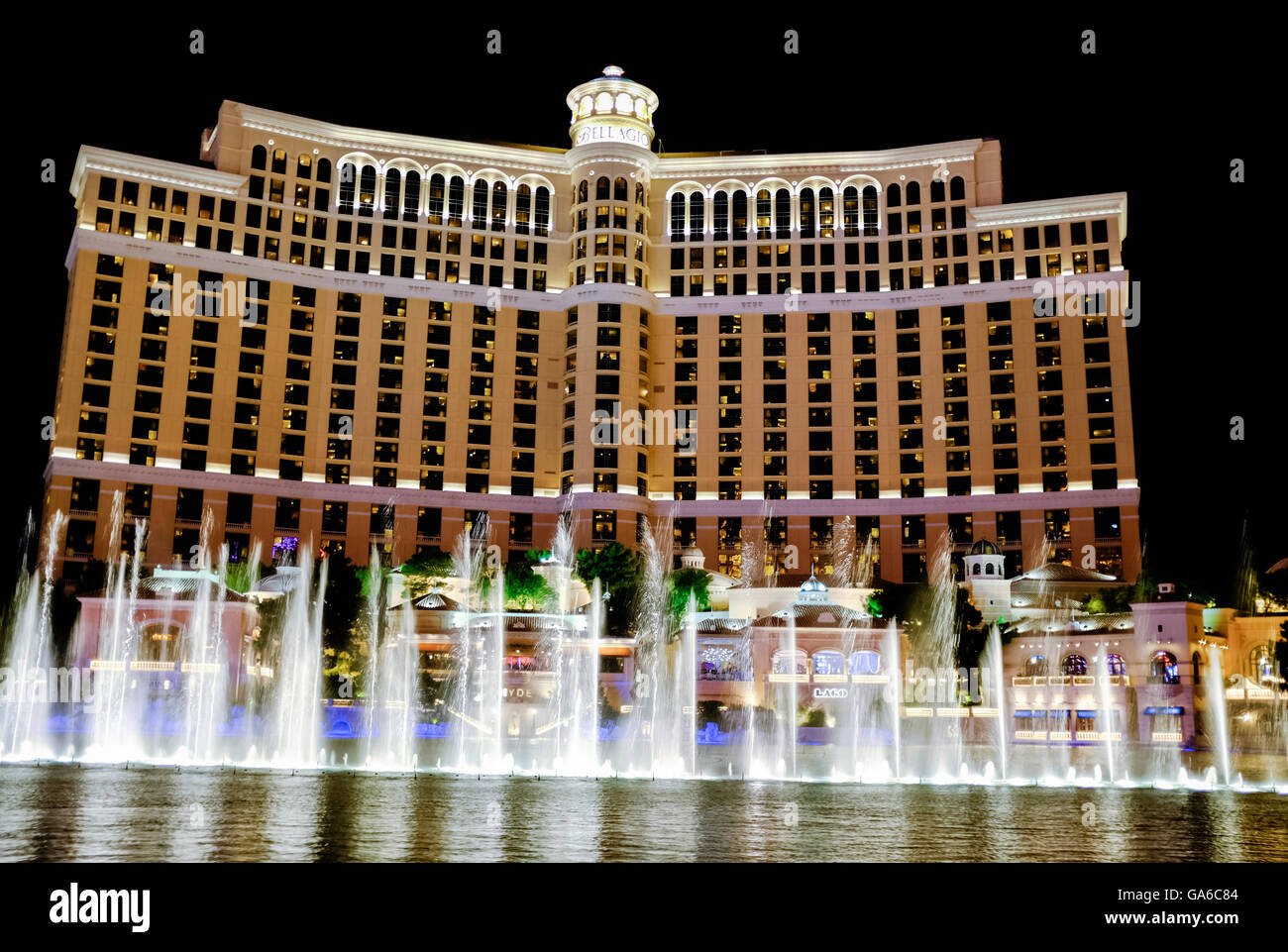 View of The Bellagio Hotel and Casino at night with lights reflecting off the water - Las Vegas, NV Stock Photo
