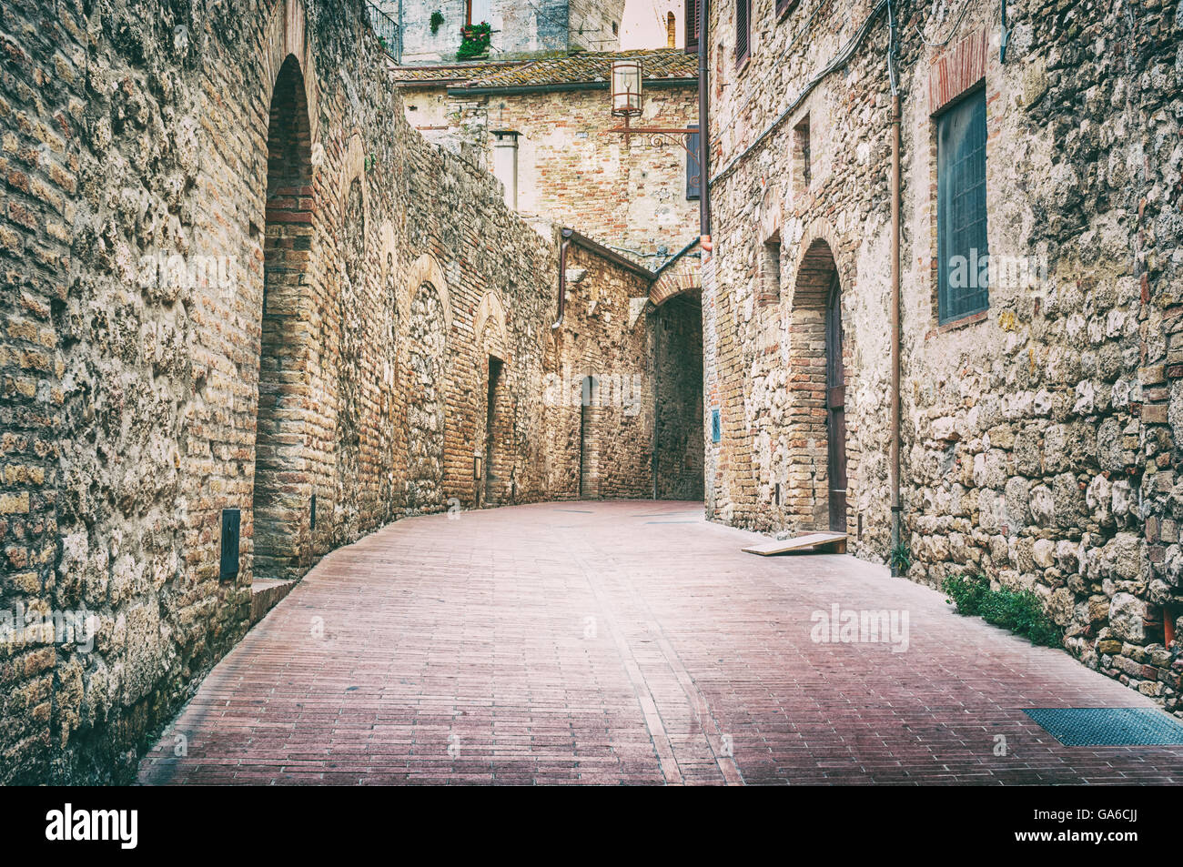 Medieval street view in San Gimignano, Italy Stock Photo - Alamy