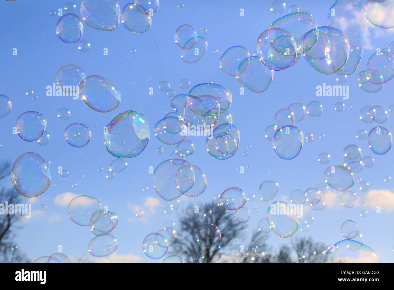 Delicate soap bubbles floating in a blue sky Stock Photo - Alamy
