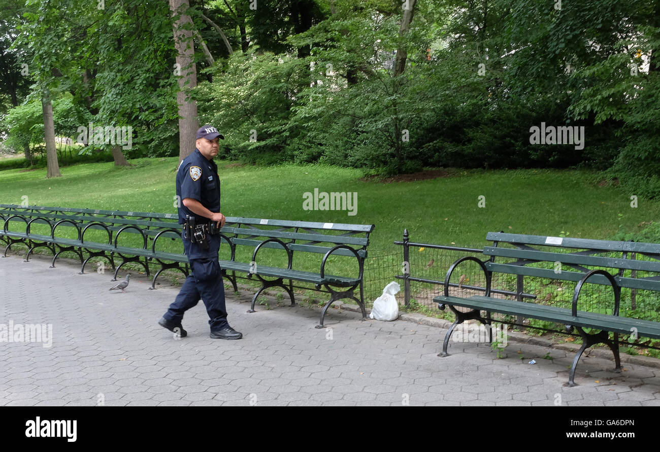 New York City, United States. 03rd July, 2016. NYPD officer gingerly ...