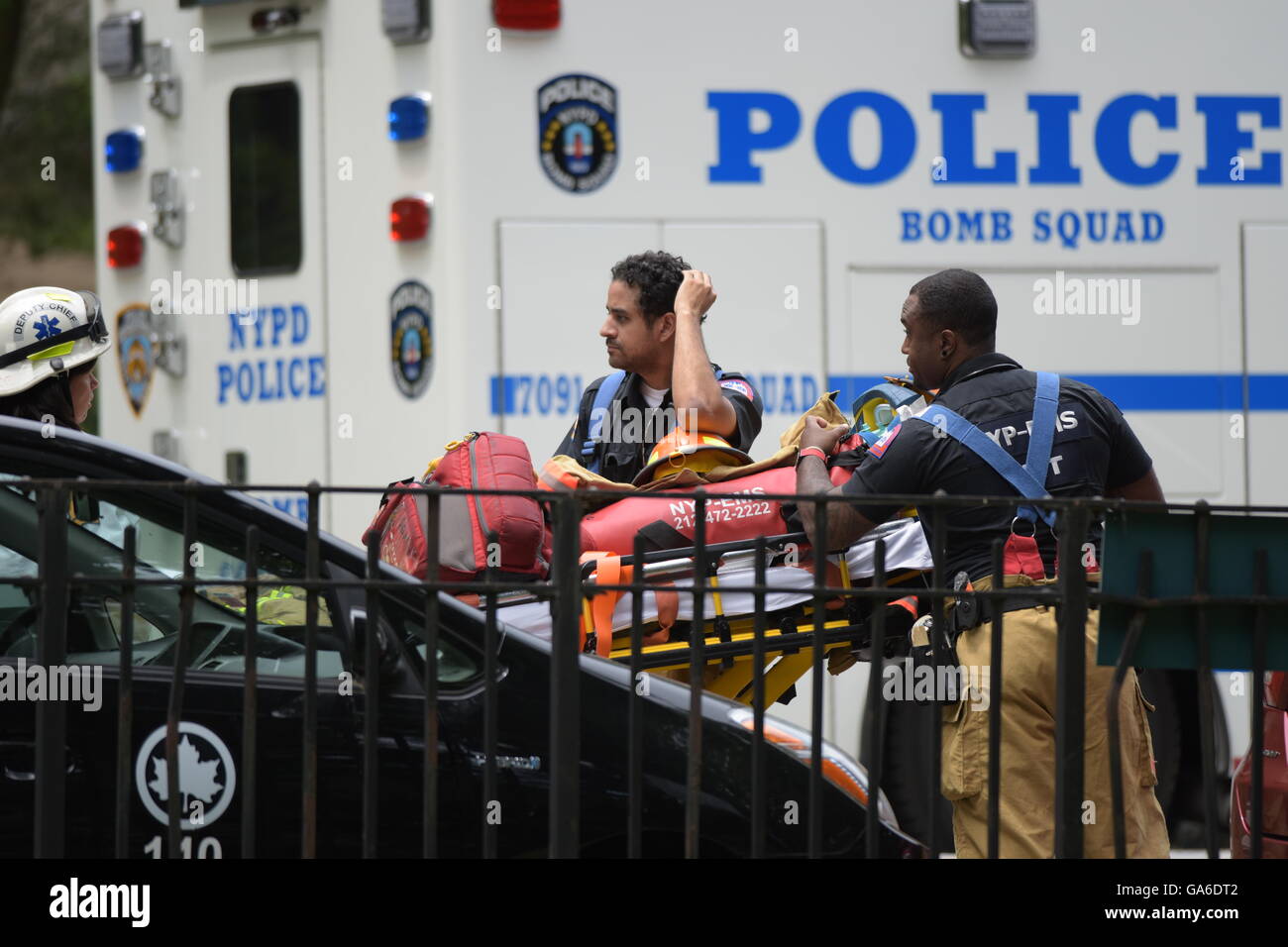 New York City, United States. 03rd July, 2016. EMS personnel stand by ...