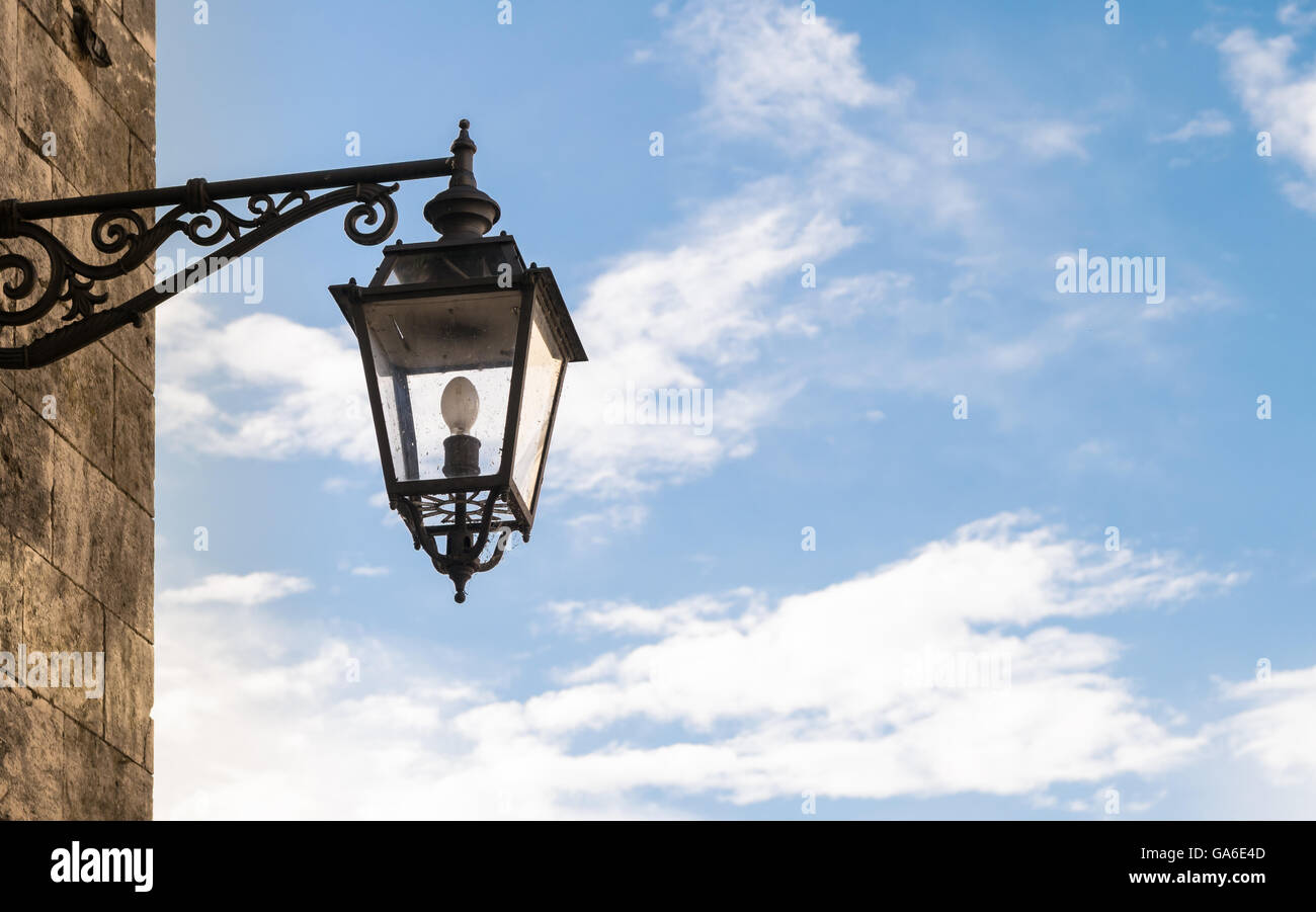 Old street lamp in wrought iron with copy space. Stock Photo