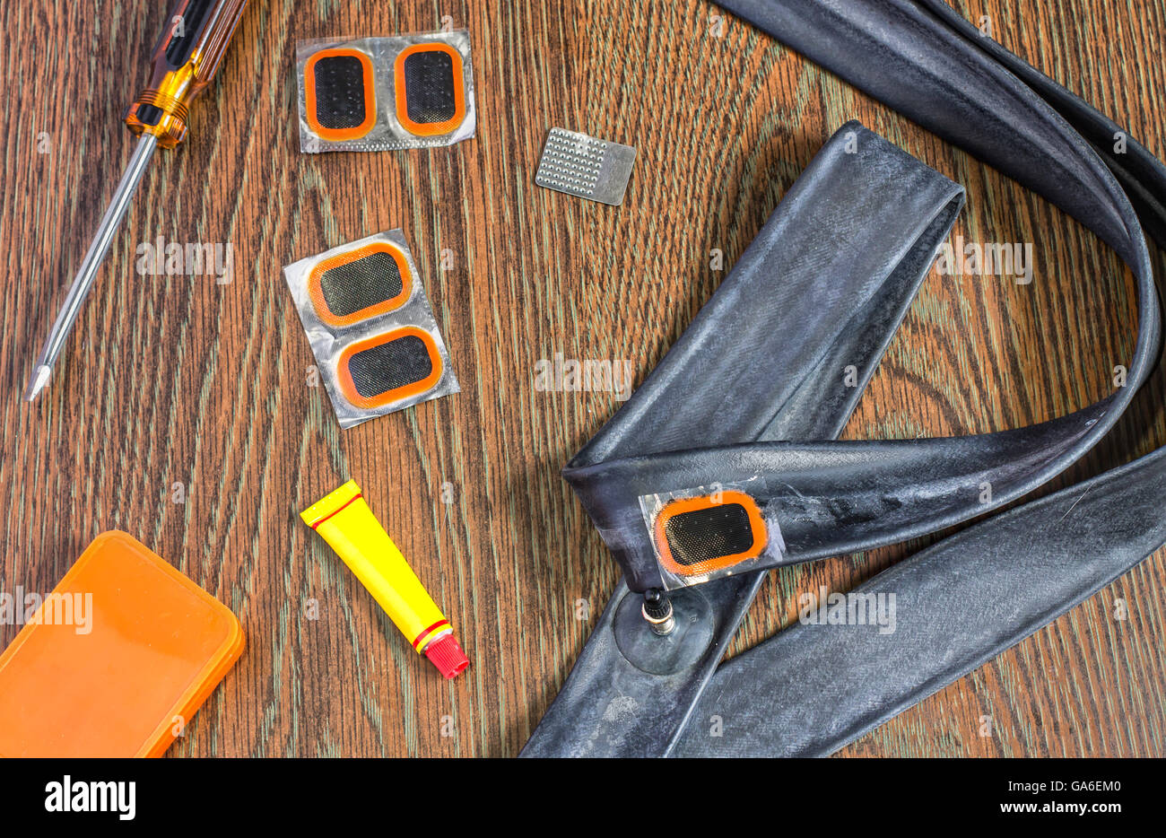 bicycle repair kit, wheels camera on wooden background Stock Photo - Alamy