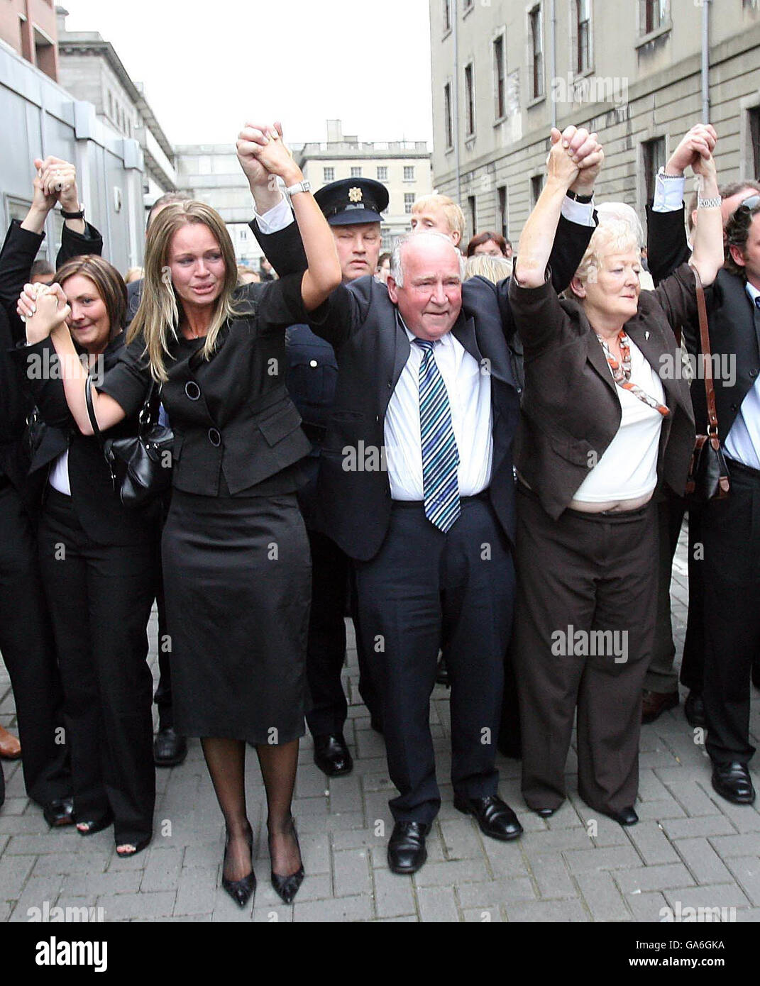 The family of Rachel O'Reilly, including her Sister Ann (centre left), Mother Rose (centre right) and Father Jim Callaly (centre) leave the Central Criminal Court, Dublin. Stock Photo