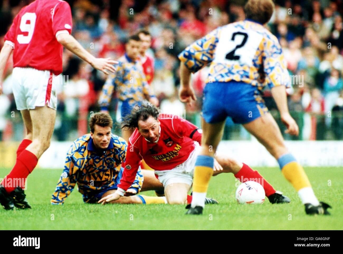 (On the floor l-r) Shrewsbury Town's Mark Barham and Wrexham's Mickey Thomas Stock Photo