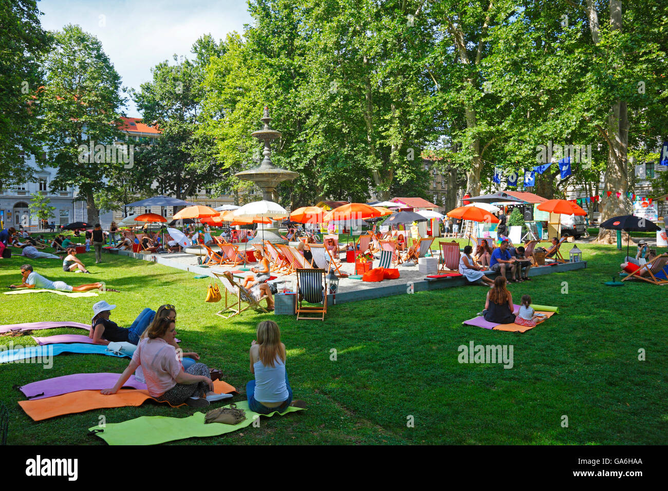 Tourists enjoy summertime in the park Zrinjevac in Zagreb Stock Photo