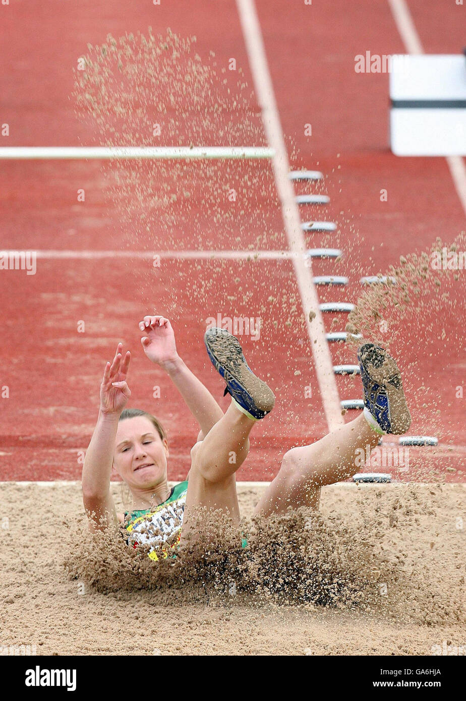 Rebecca White lands in the sand on her way to second place in the Womens' Triple Jump during the Norwich Union World Trials and UK Championships at the Manchester Regional Arena, Manchester. Stock Photo