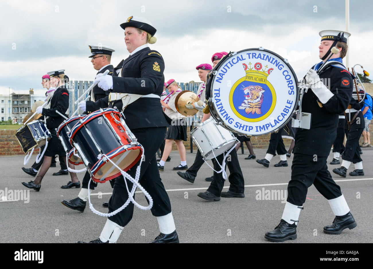 Military marching band in uniform playing drums. Stock Photo